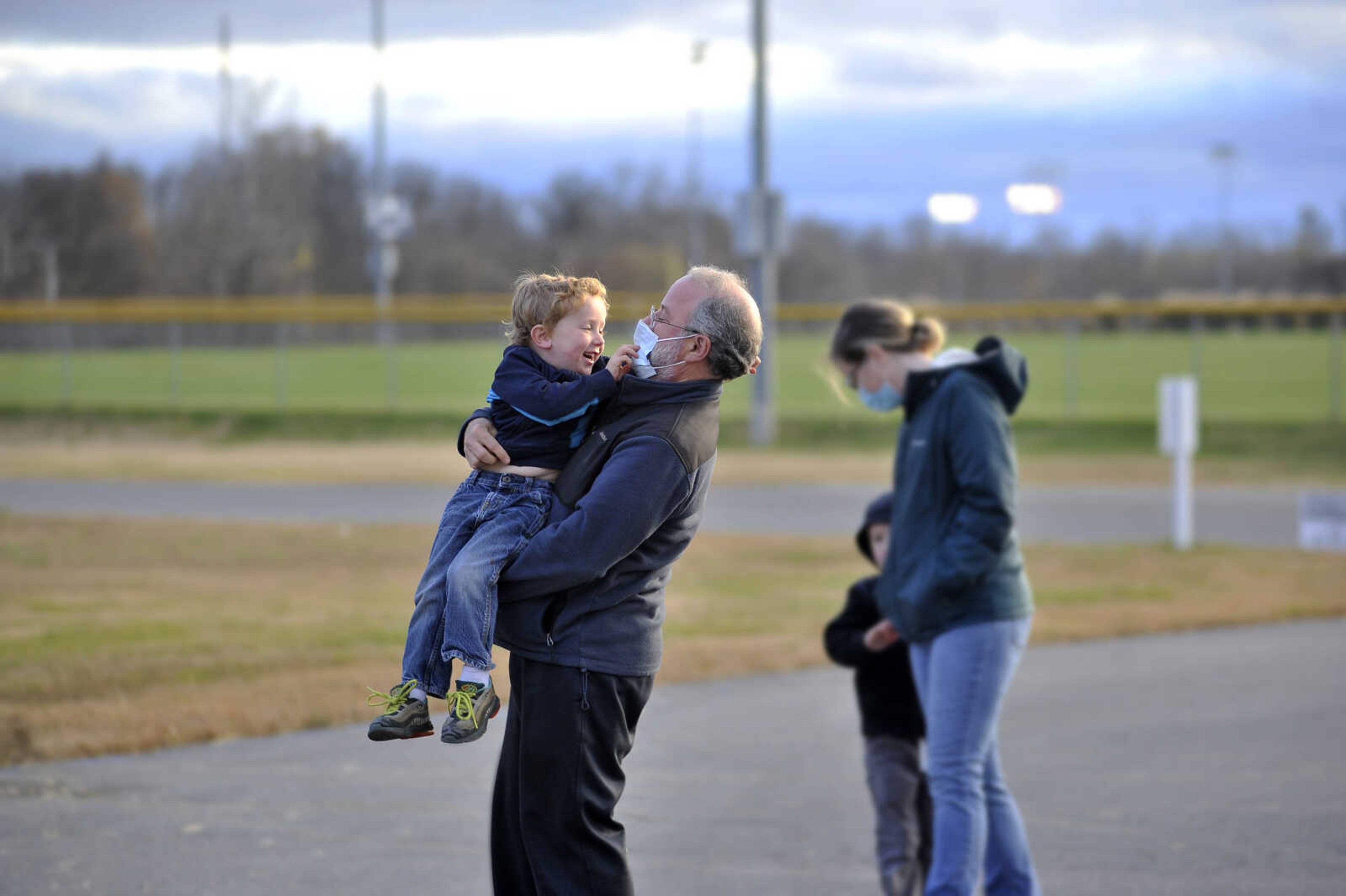 Bill Bradley picks up his son, Hank, 4, and spins him around at the Fall Family Festival on Sunday, Nov. 22, 2020, at Shawnee Park Center in Cape Girardeau.