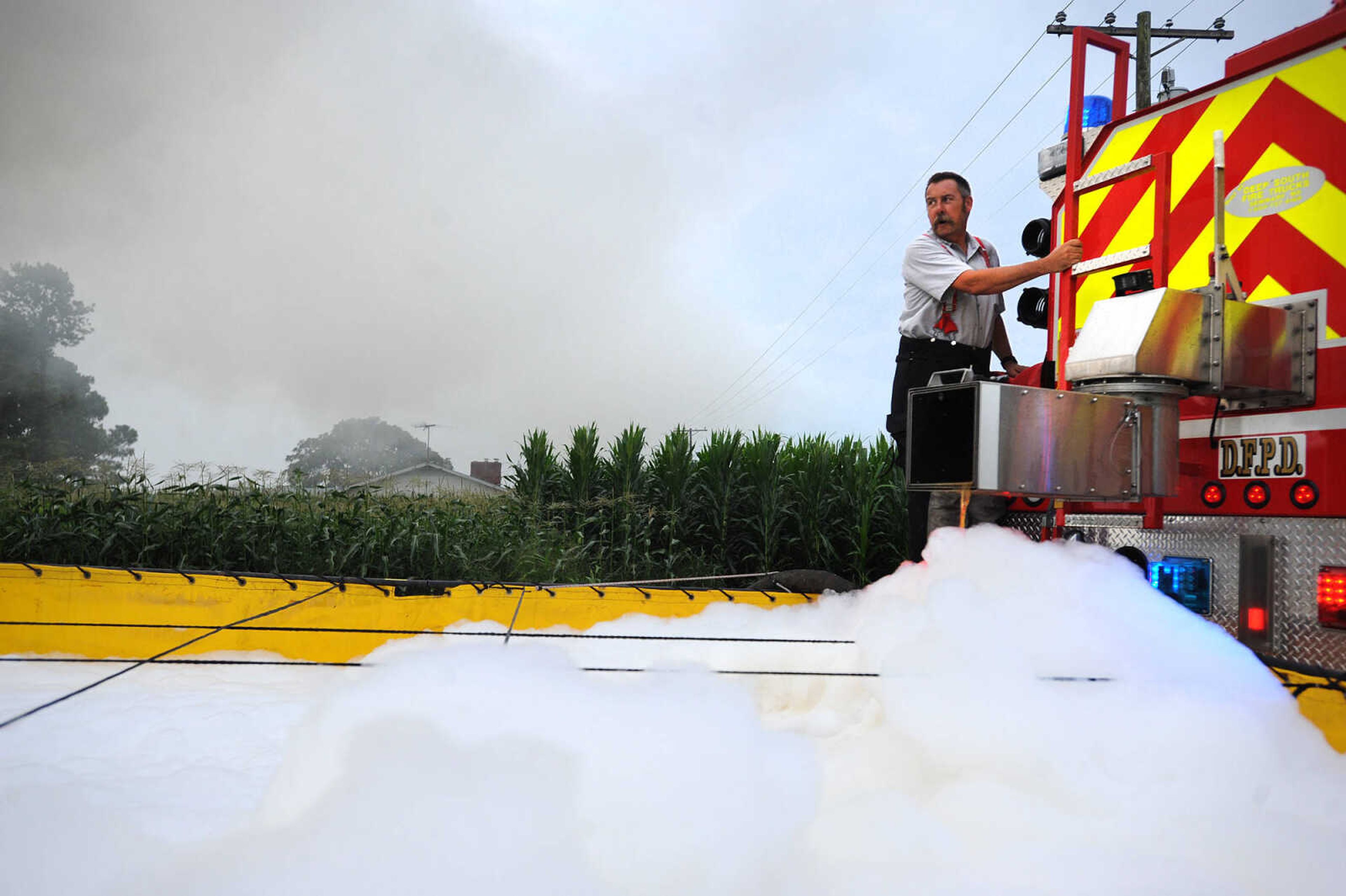 LAURA SIMON ~ lsimon@semissourian.com

Doug Sutterfield with Delta Fire Protection District refills the water reserve as firefighters from Delta, Scott City, Chaffee and New Hamburg/Benton/Commerce battle a house fire off County Road 204 in Scott County Wednesday afternoon, July 23, 2014.