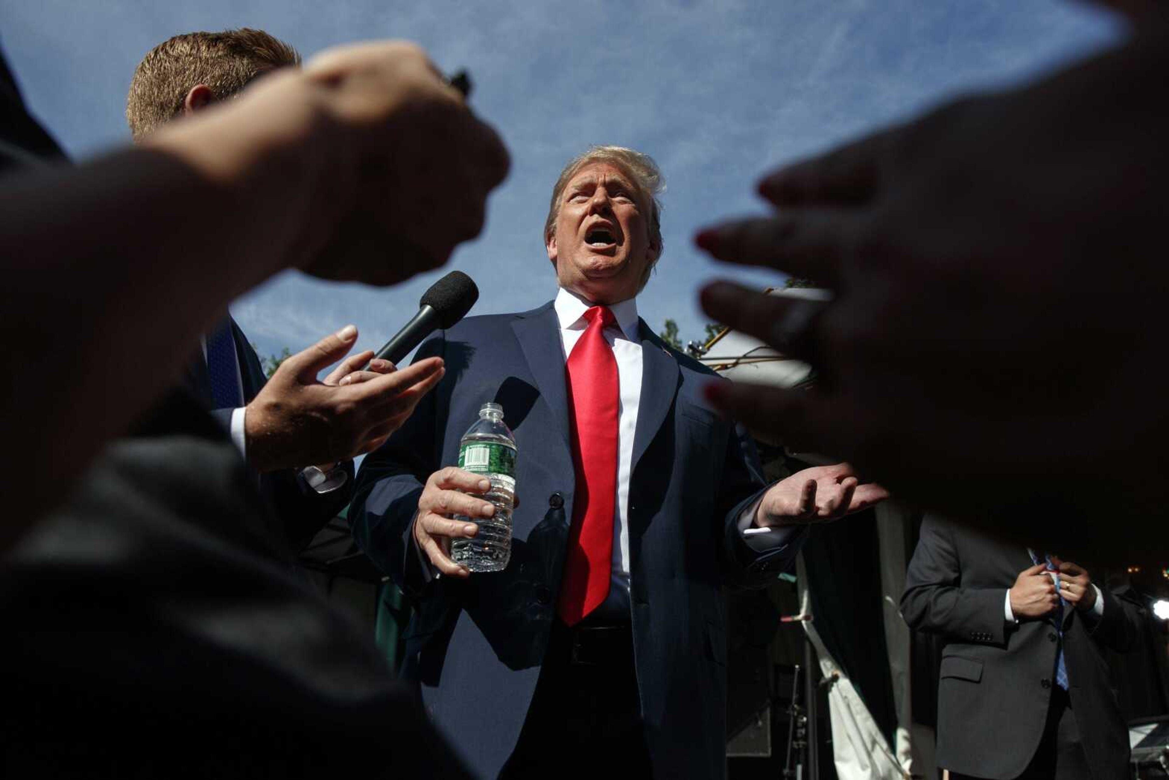 President Donald Trump speaks to reporters Friday at the White House in Washington.