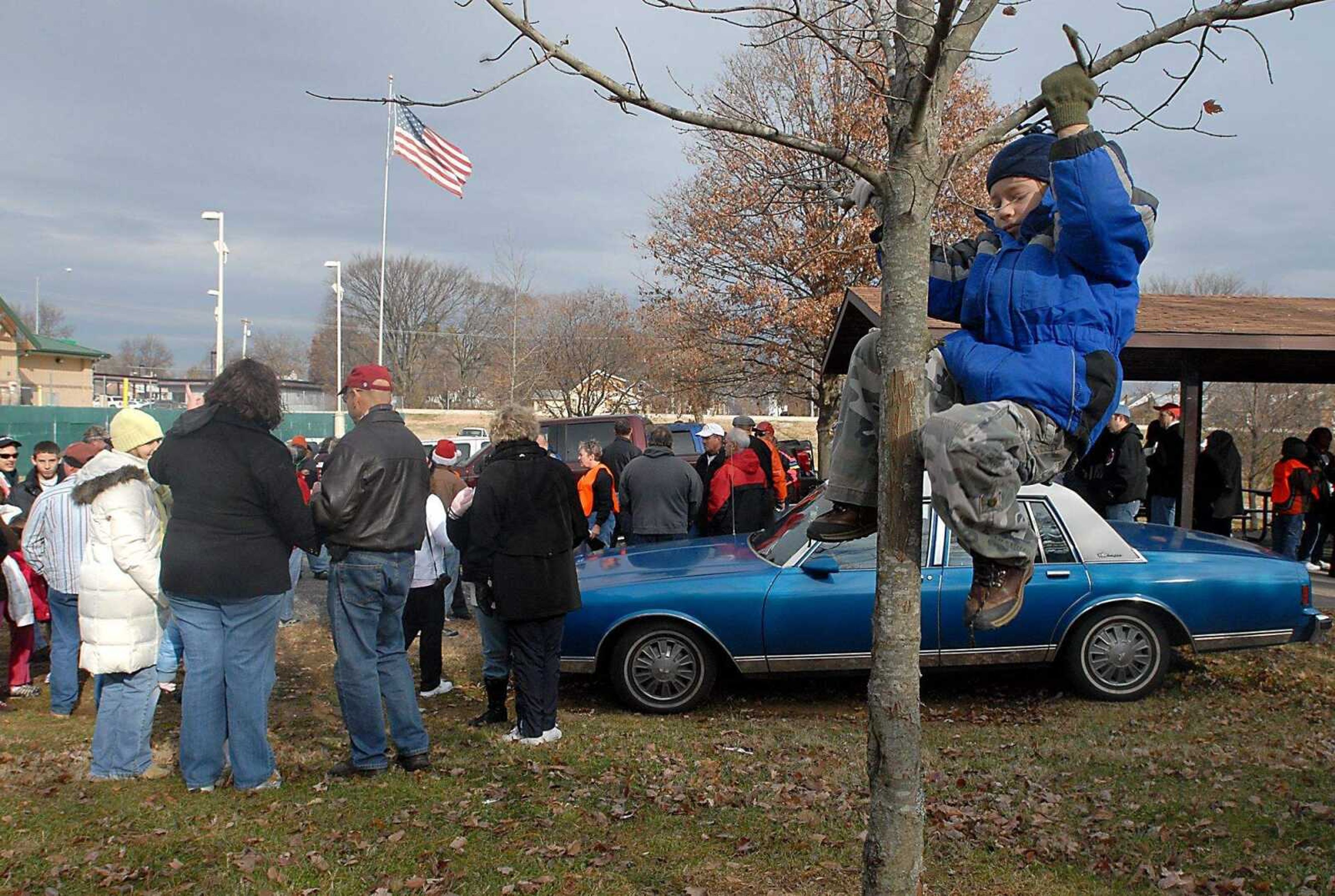 KIT DOYLE ~ kdoyle@semissourian.com
Six-year-old Lucas Grammer climbs a tree Saturday morning, December 6, 2008, before the march from Ranney Park to Hanover St. begins.