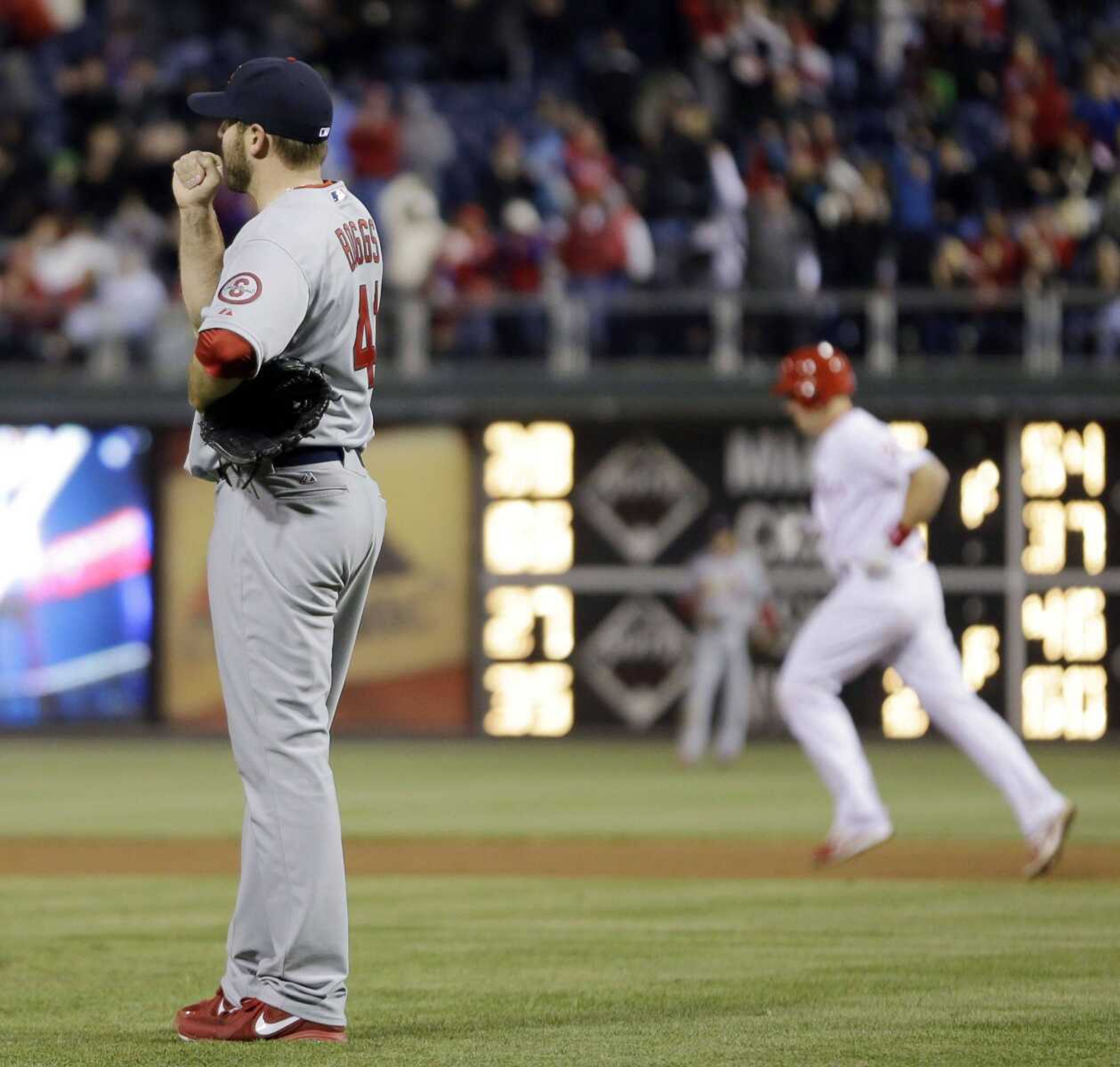 St. Louis Cardinals relief pitcher Mitchell Boggs, left, reacts after giving up a three-run home run to Philadelphia Phillies' Erik Kratz during the eighth inning of a baseball game, Sunday, April 21, 2013, in Philadelphia. Philadelphia won 7-3. (AP Photo/Matt Slocum)