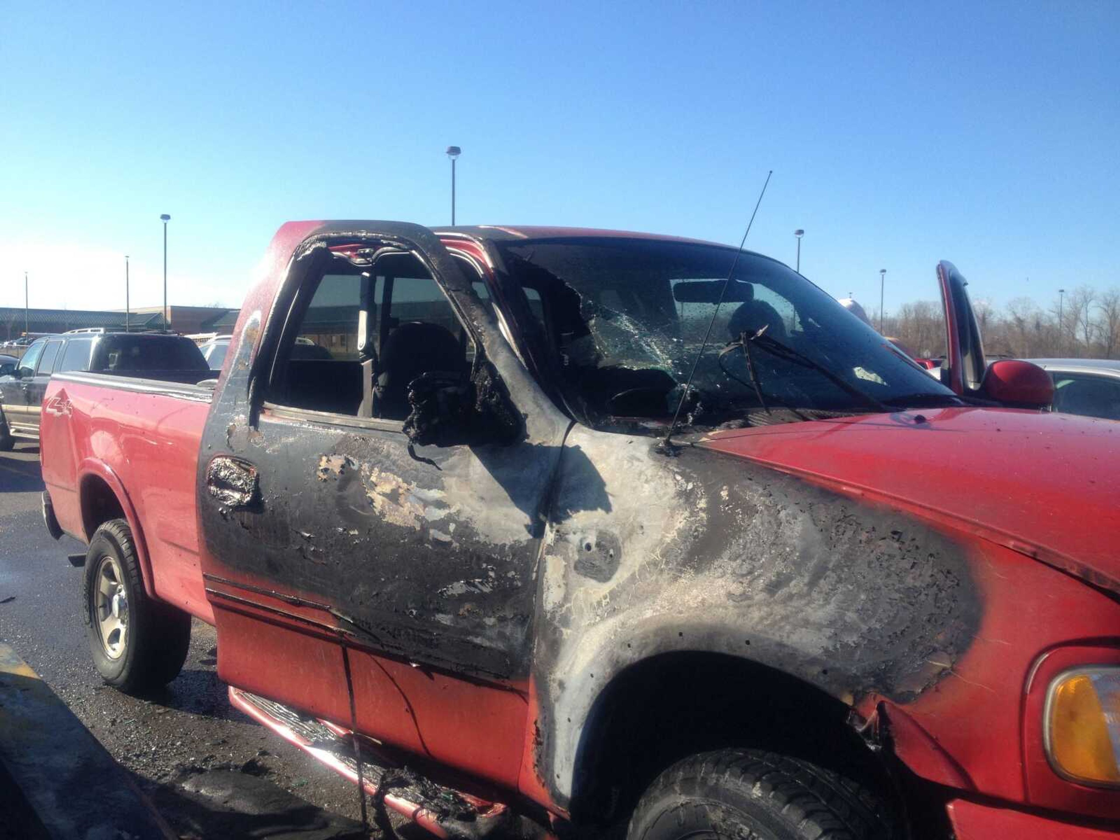 A Ford pickup truck was damaged when a Ford Mustang caught fire Thursday morning in Central High School's parking lot.