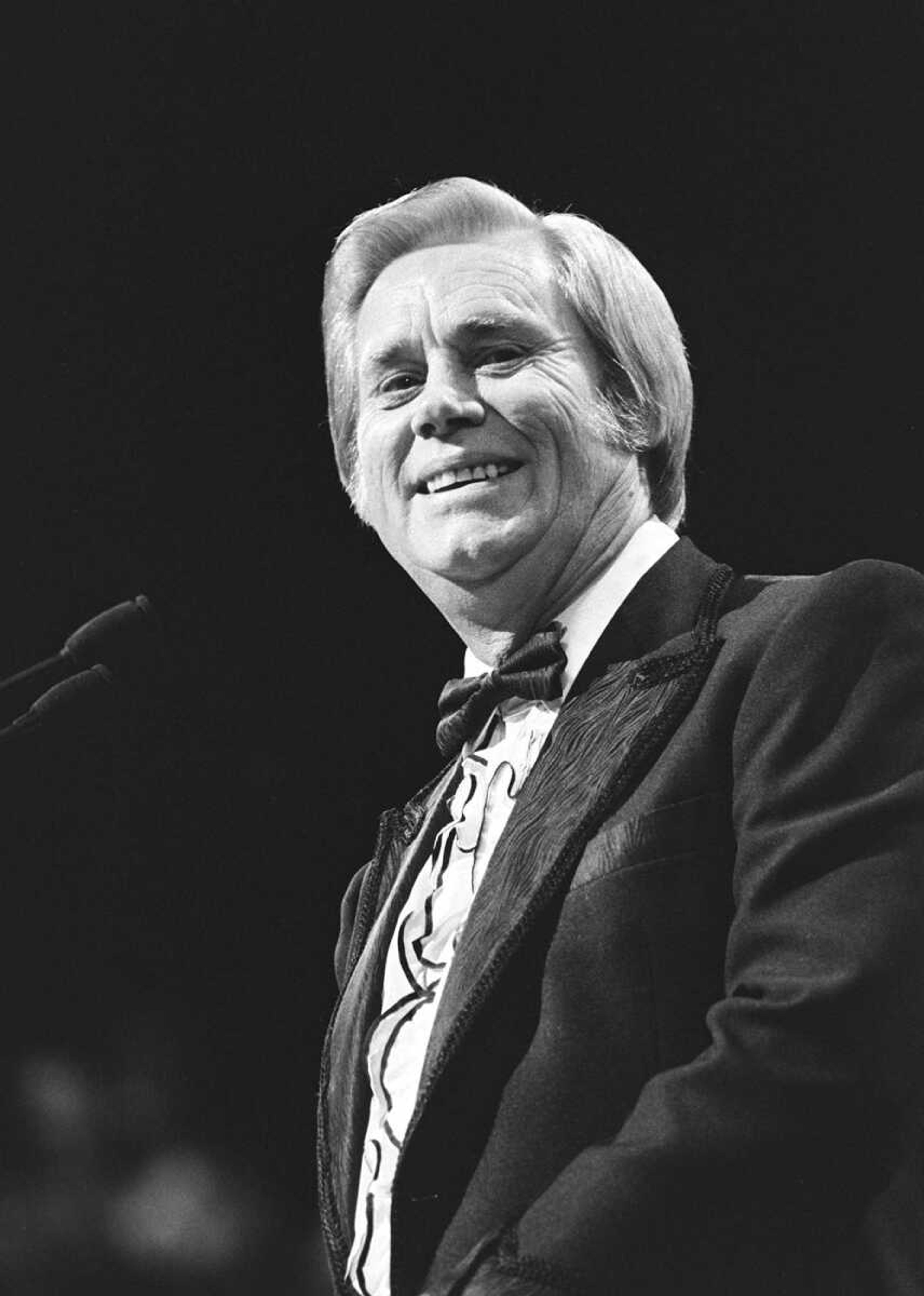 FILE - In this Oct. 13, 1996 file photo, George Jones thanks the crowd after winning Video of the Year for "Who's Gonna Fill Their Shoes" during the CMA Awards show at the Grand Ole Opry House.  ones, the peerless, hard-living country singer who recorded dozens of hits about good times and regrets and peaked with the heartbreaking classic "He Stopped Loving Her Today," has died. He was 81. Jones died Friday, April 26, 2013 at Vanderbilt University Medical Center in Nashville after being hospitalized with fever and irregular blood pressure, according to his publicist Kirt Webster. (AP Photo/The Tennessean, Bill Welch)  NO SALES