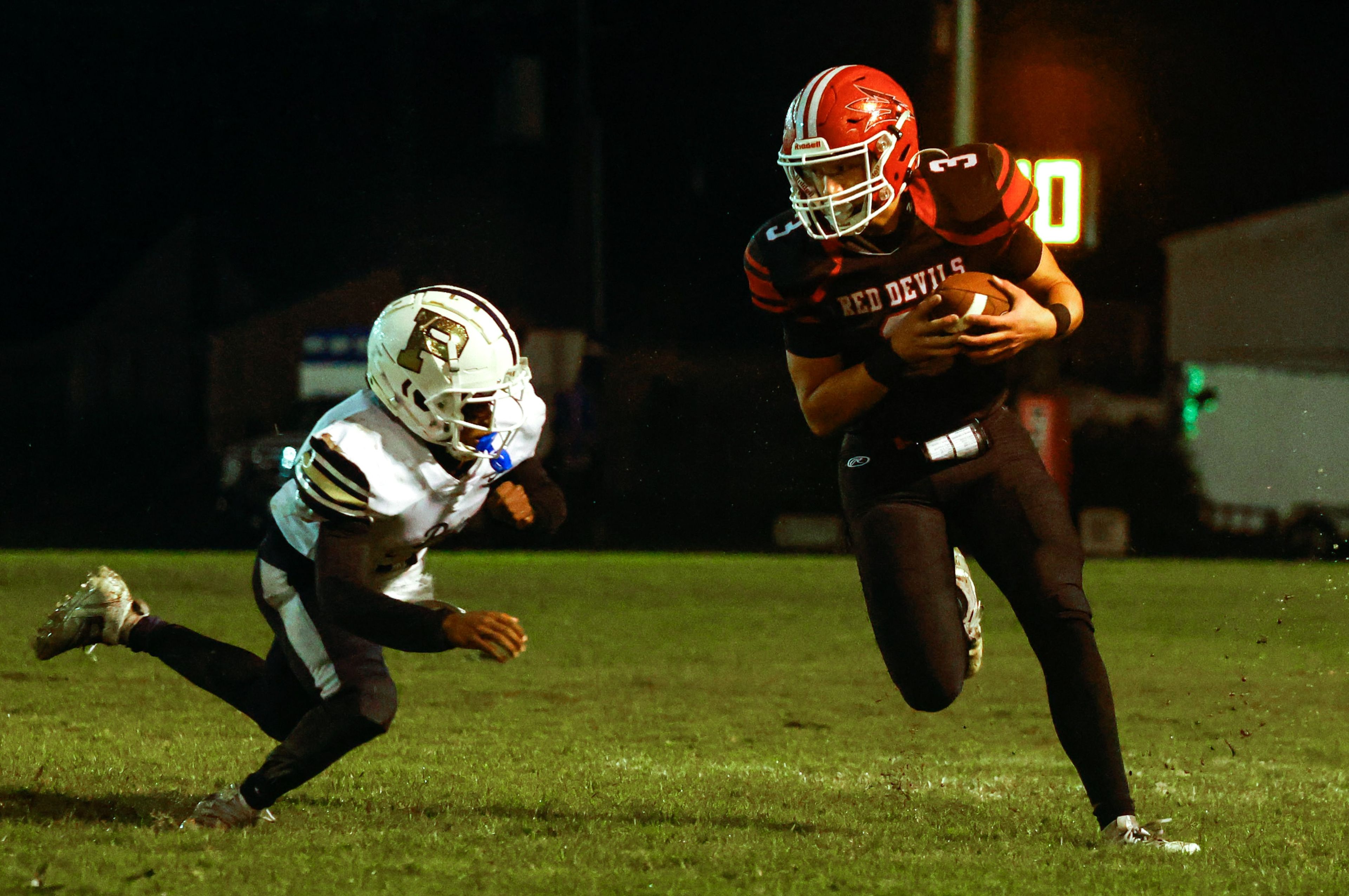 Chaffee WR, Rolen Reischman, makes his way down field past principia defender at Chaffee High School on Friday, September 27th.