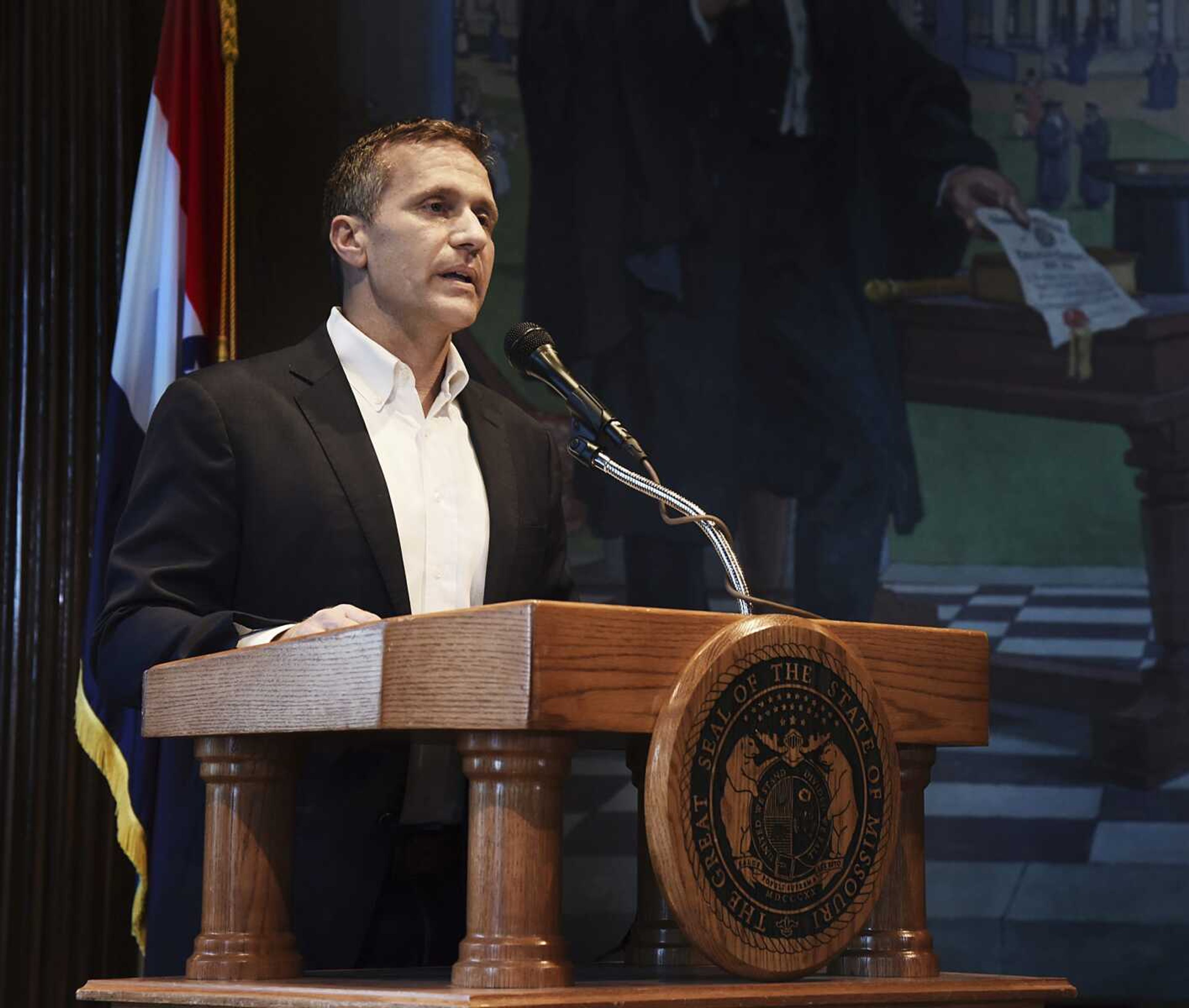 Gov. Eric Greitens reads from a prepared statement as he announces his resignation during a news conference May 29, 2018, at the state Capitol in Jefferson City, Missouri.