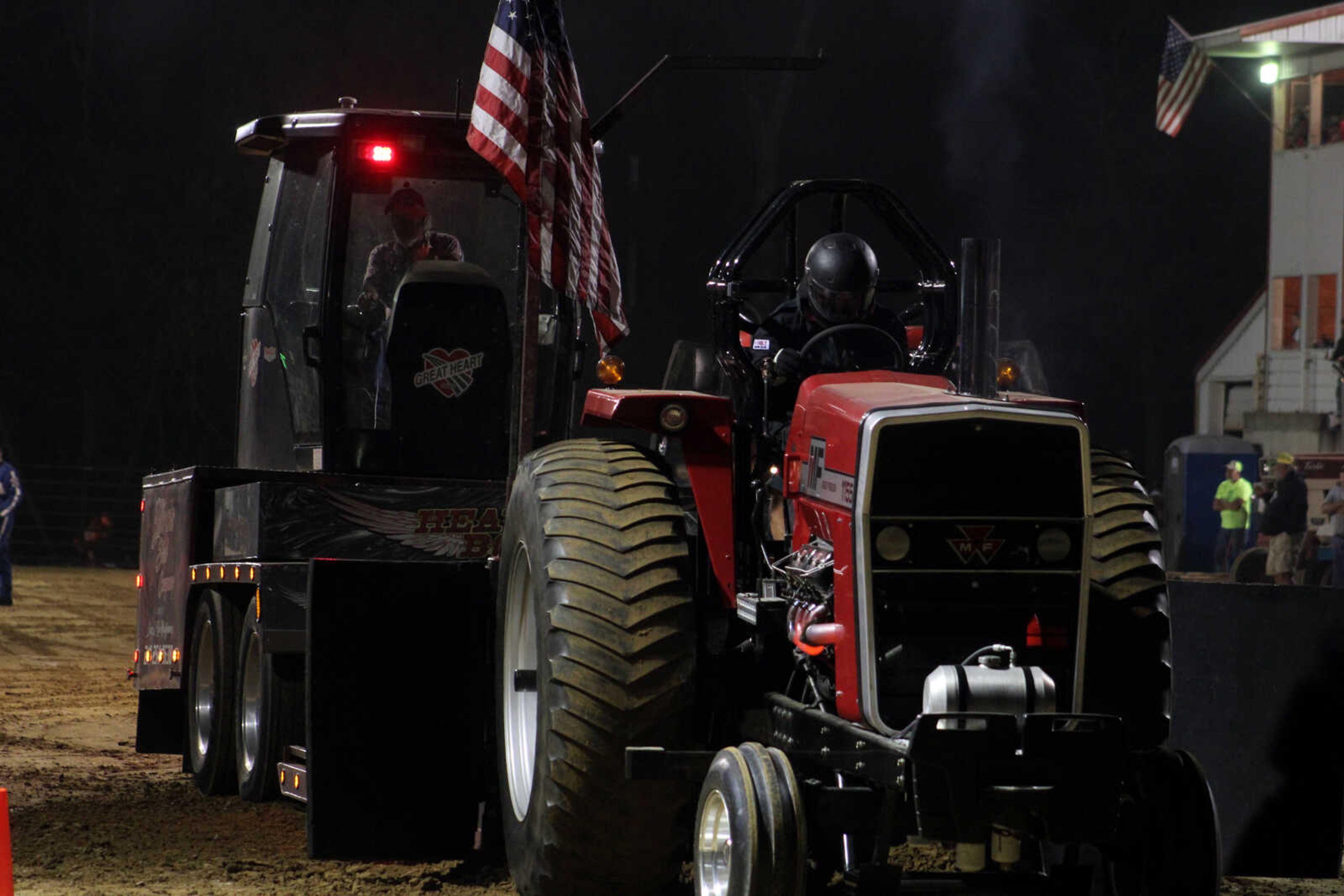 A tractor sees how much weight it can pull and how far during the new Hot Rod and Out-of-Field Tractor Pull at the East Perry Community Fair Saturday, Sept. 25, 2021, in Altenburg, Missouri.