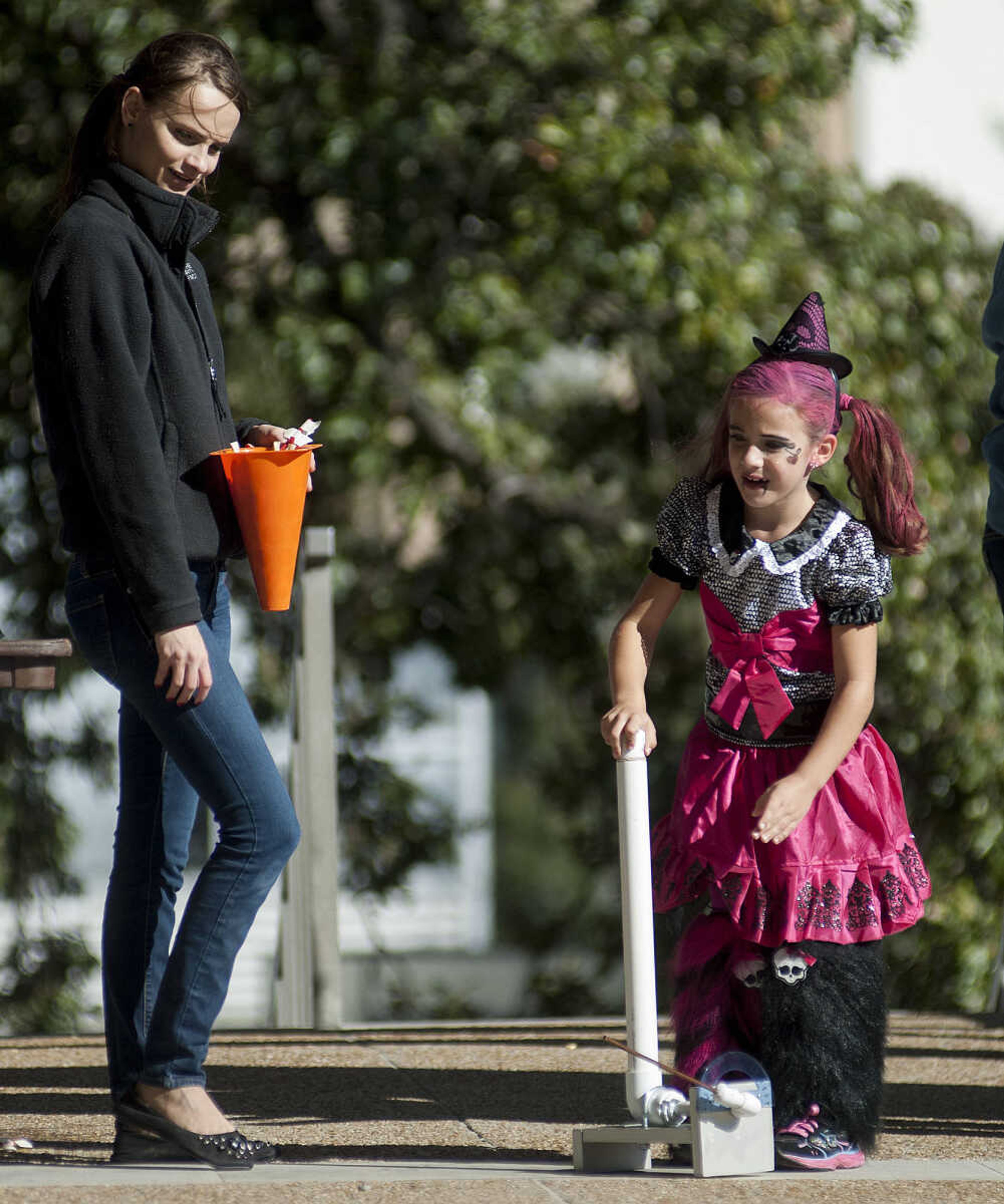 Southeast Missouri State University student Shannon Kelley, left, helps Norah Macke, 6, launch a rocker at the "Launch Pad," during the fifth annual Halloween Science Night Sunday, Oct. 20, on the campus of Southeast Missouri State University. The event featured 21 stations, such as the "Scream Room," "Creepy Creatures," or the "Mucus Lab," each with a different Halloween themed science activity. The night is funded by a grant from the Missouri Foundation for Health in partnership with Southeast's College of Science, Technology and Agriculture and Extended and Continuing Education.