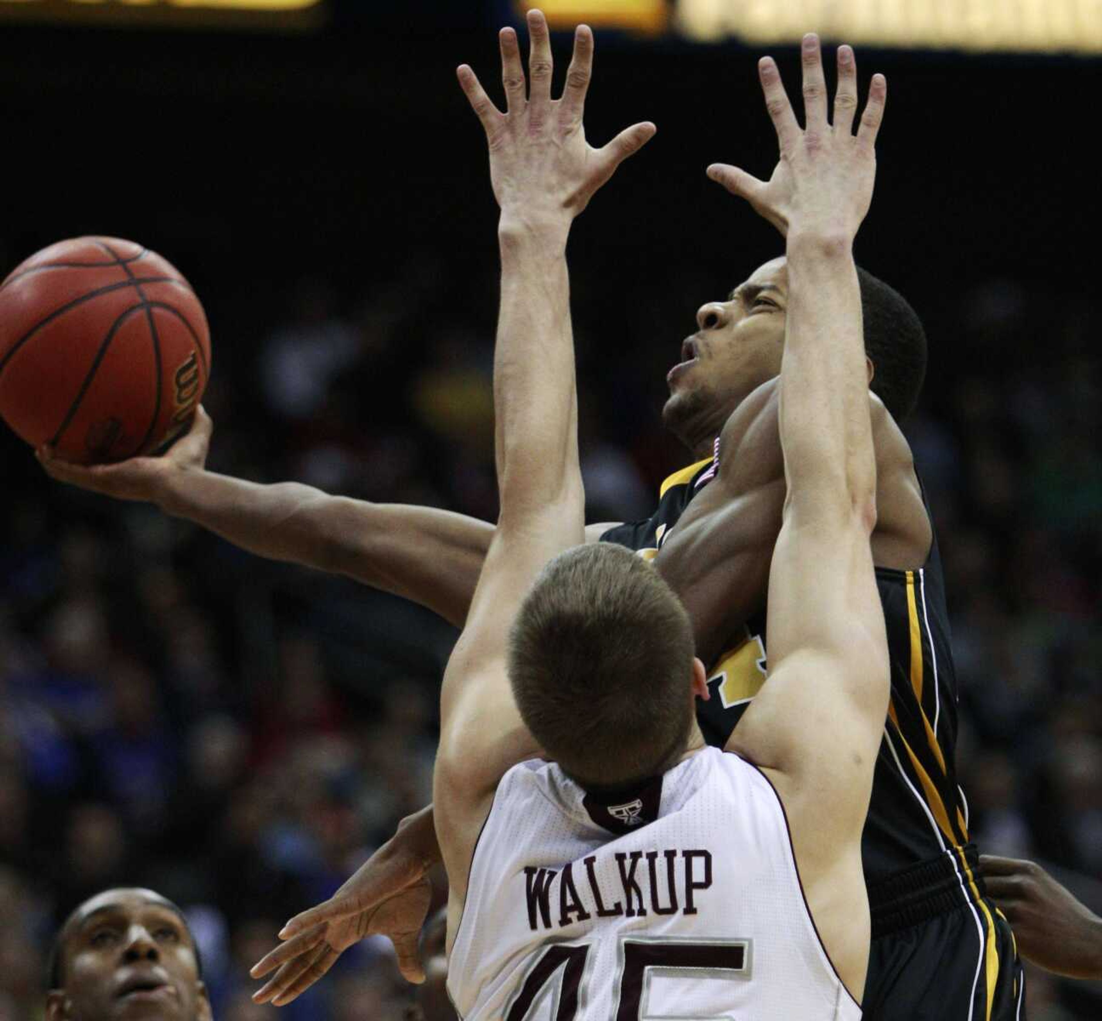 Missouri guard Kim English drives to the basket against Texas A&amp;M forward Nathan Walkup during their second-round game in the Big 12 tournament Thursday in Kansas City, Mo.<br><b>Orlin Wagner</b><br>Associated Press