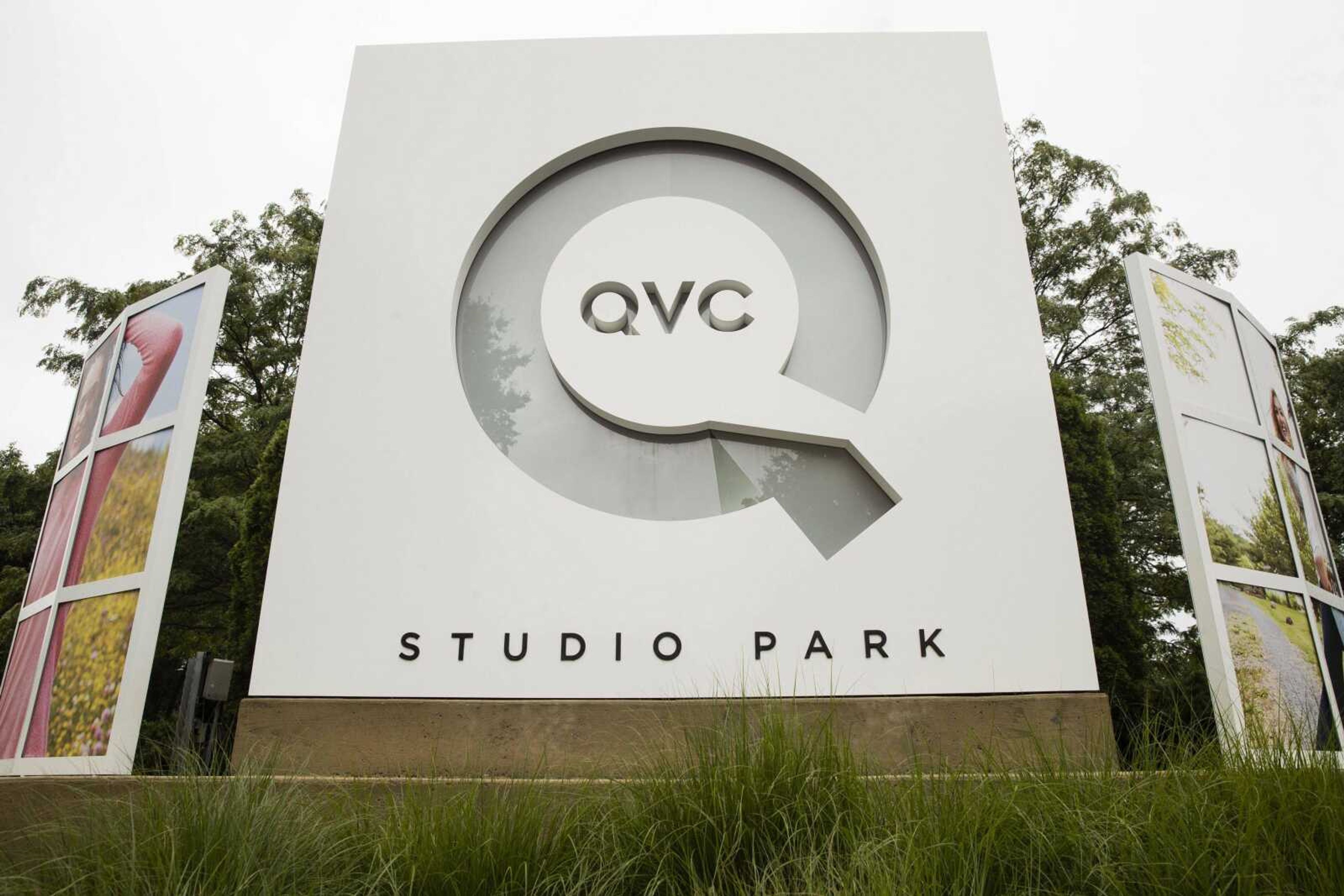 Corporate signage is shown Friday outside a QVC facility in West Chester, Pennsylvania.