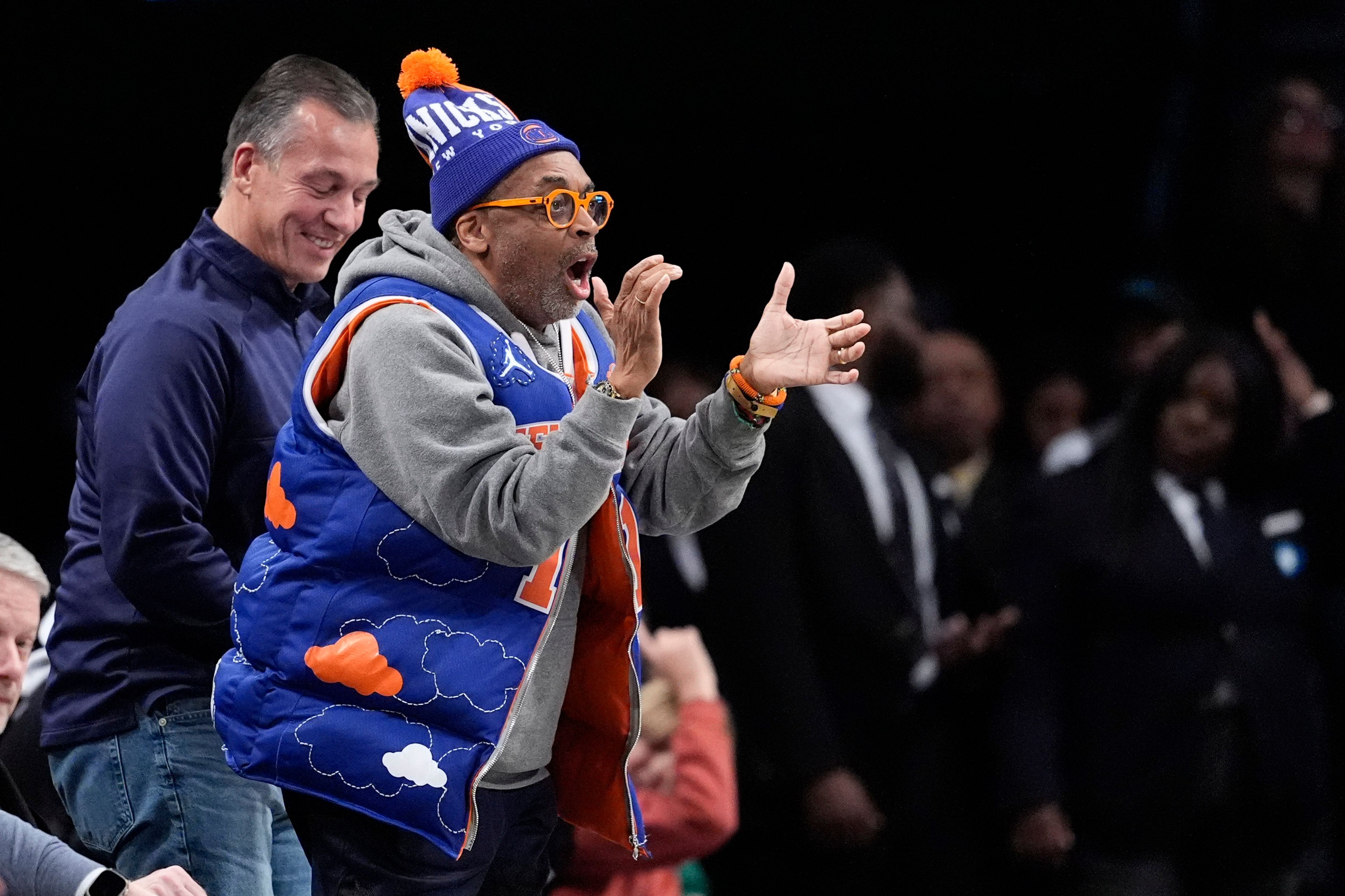 FILE - Film director Spike Lee cheers during the second half of an NBA basketball game between the Brooklyn Nets and the New York Knicks, Tuesday, Jan. 23, 2024, in New York. (AP Photo/Mary Altaffer, File)