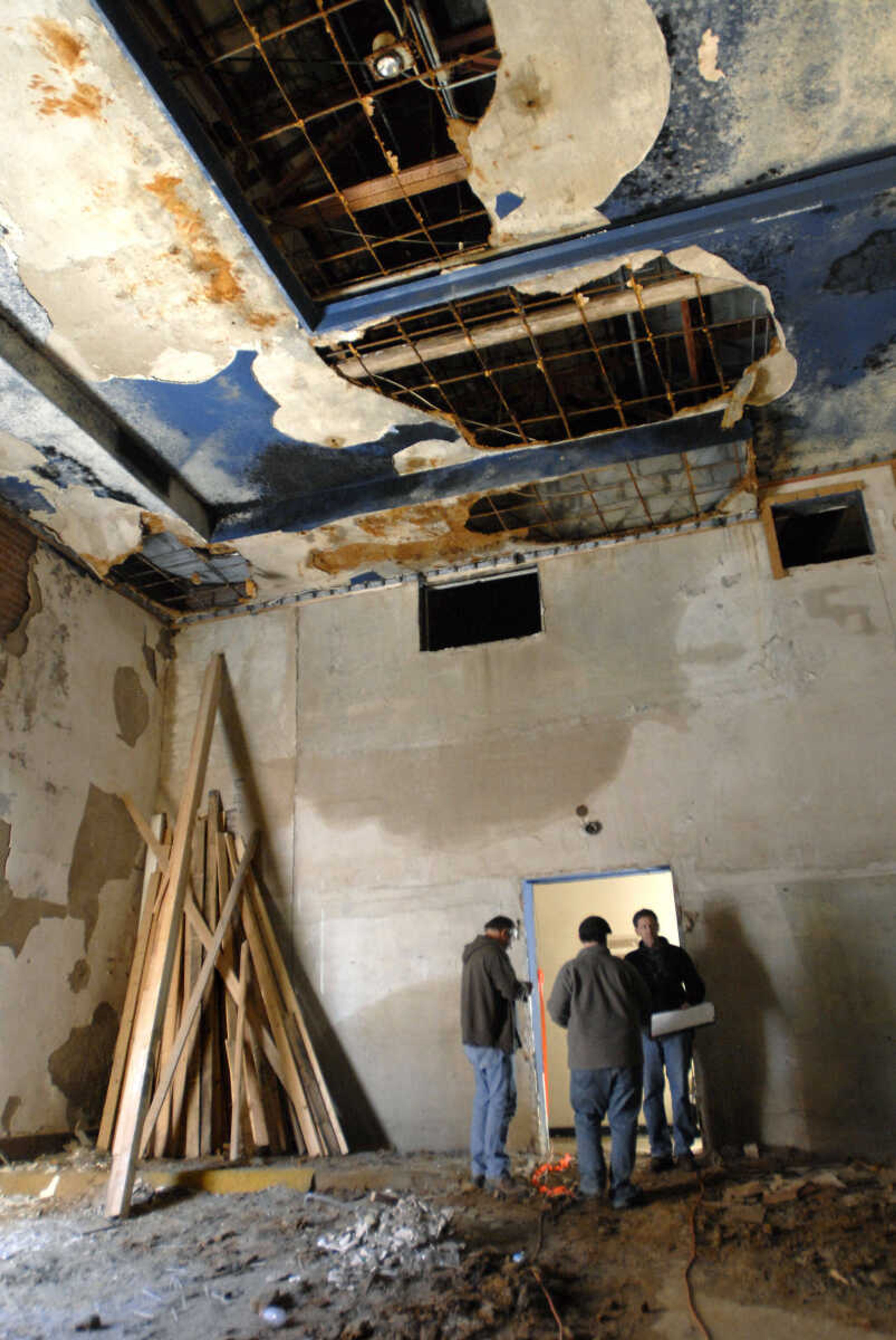 KRISTIN EBERTS ~ keberts@semissourian.com

Renovation work on the Esquire Theater continues on Friday, Jan. 6, 2012, as workers from Kiku Obata & Company and Penzel Construction complete field verification work and take measurements necessary for the design plans.