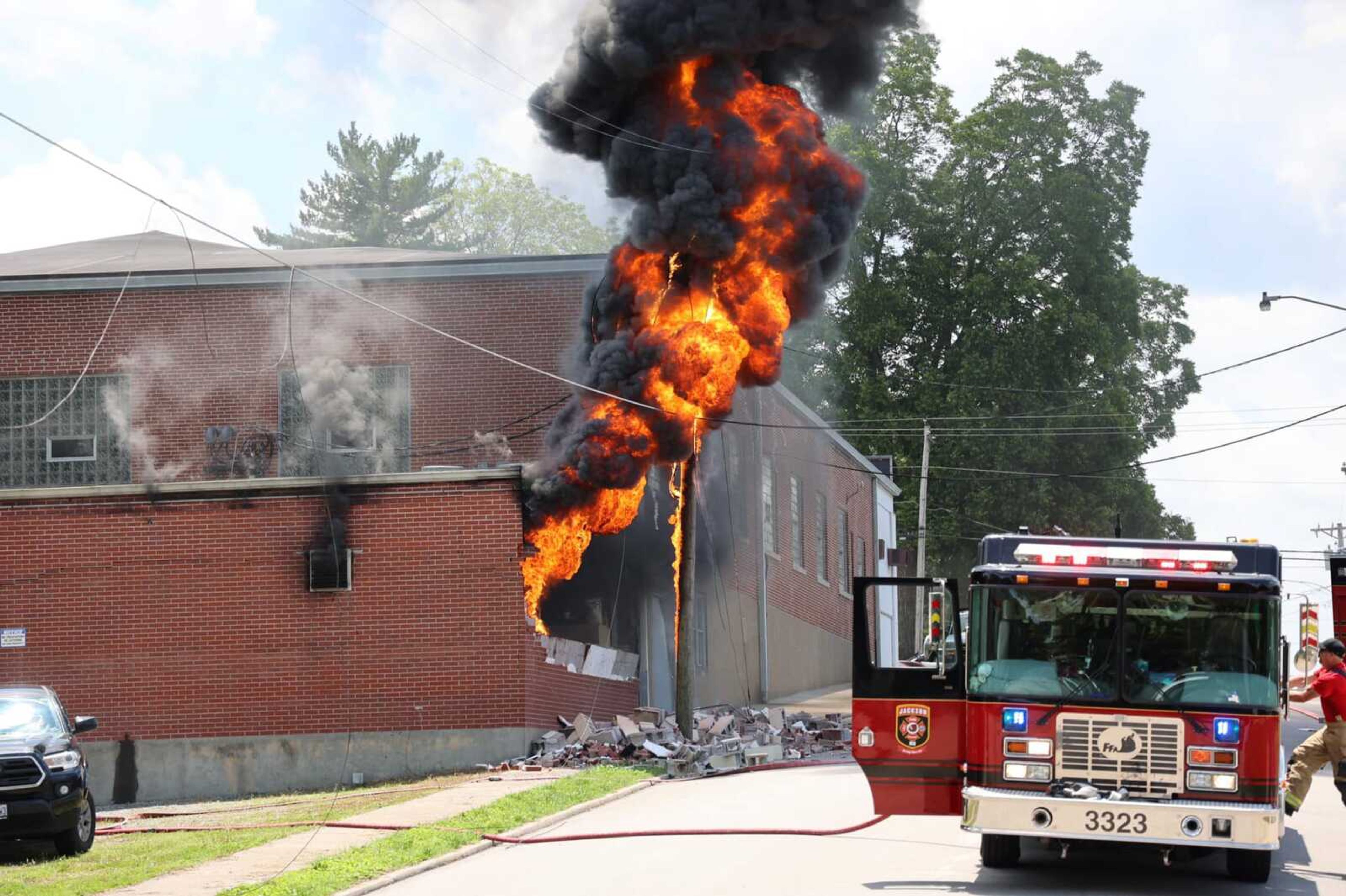 Firefighters battle a blaze at Lenco in Jackson on Friday.