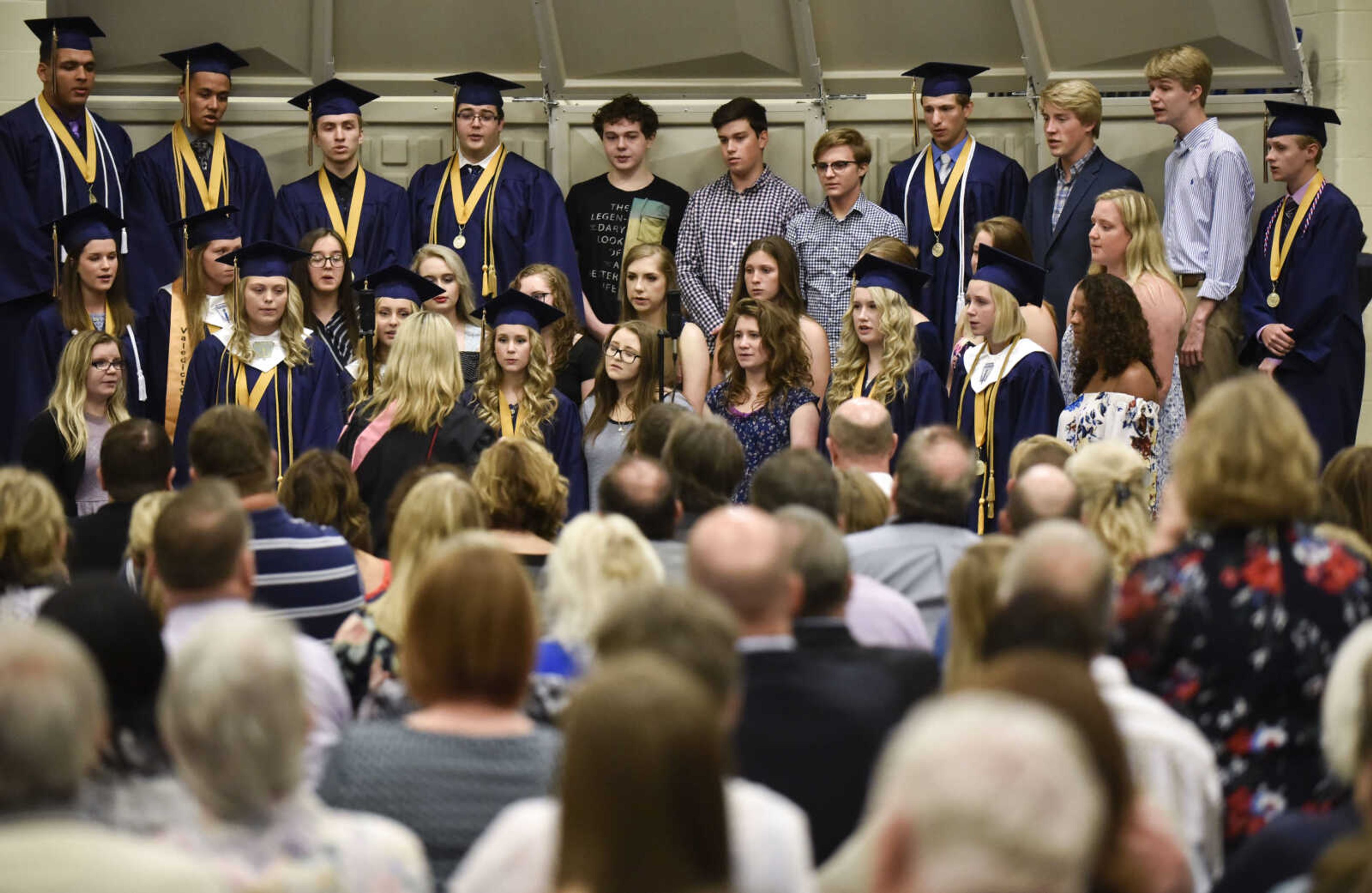 Members of the Saxony Lutheran chamber choir sing "Until We Sing Again" during the class of 2018's graduation ceremony Sunday, May 20, 2018 at Saxony Lutheran High School in Jackson.