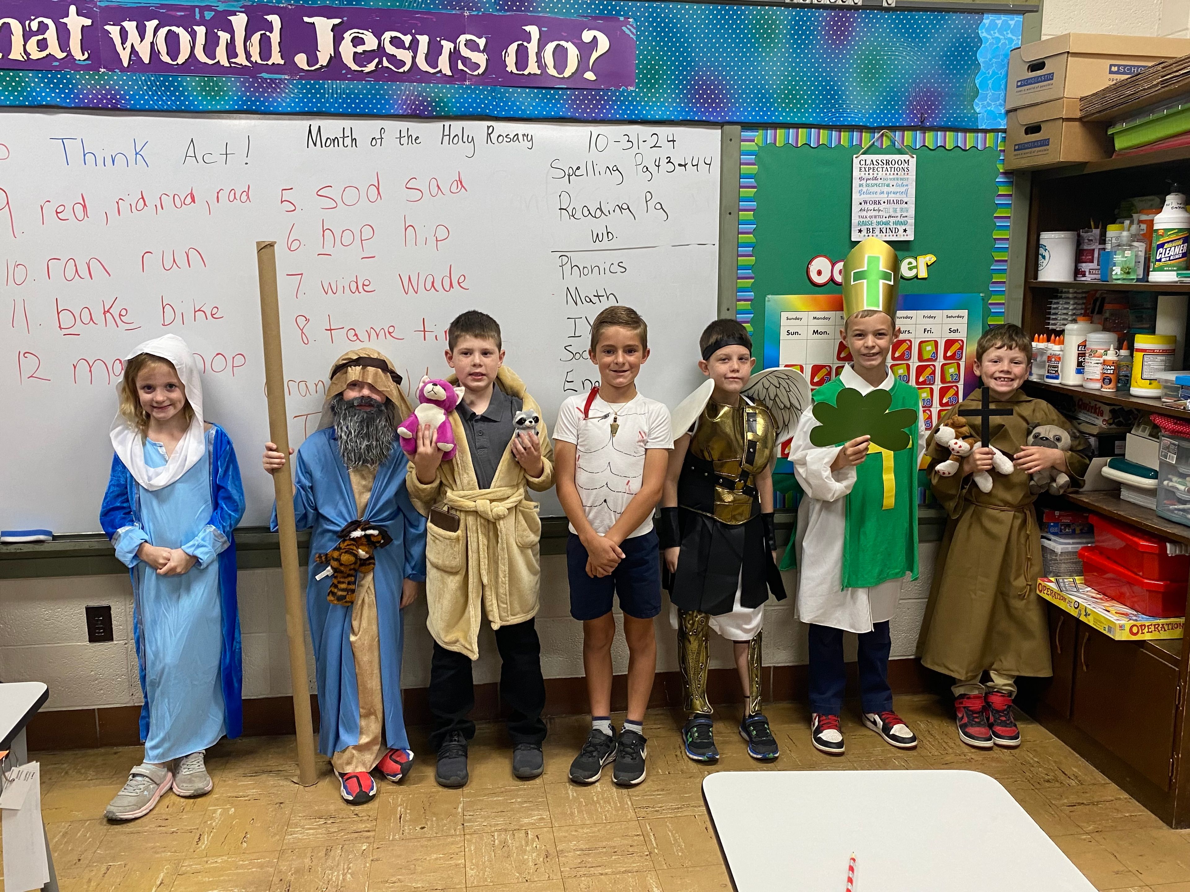 The saints in second grade were the Blessed Virgin Mary (Teagan King), Noah (Lane Seyer), St. Francis of Assisi (Jameson Levan), St. Sebastian (Sawyer Dirnberger), St. Michael the Archangel (Michael Weathers), St. Patrick (Tennyson VanGennip), & another St. Francis of Assisi (Case Taylor).