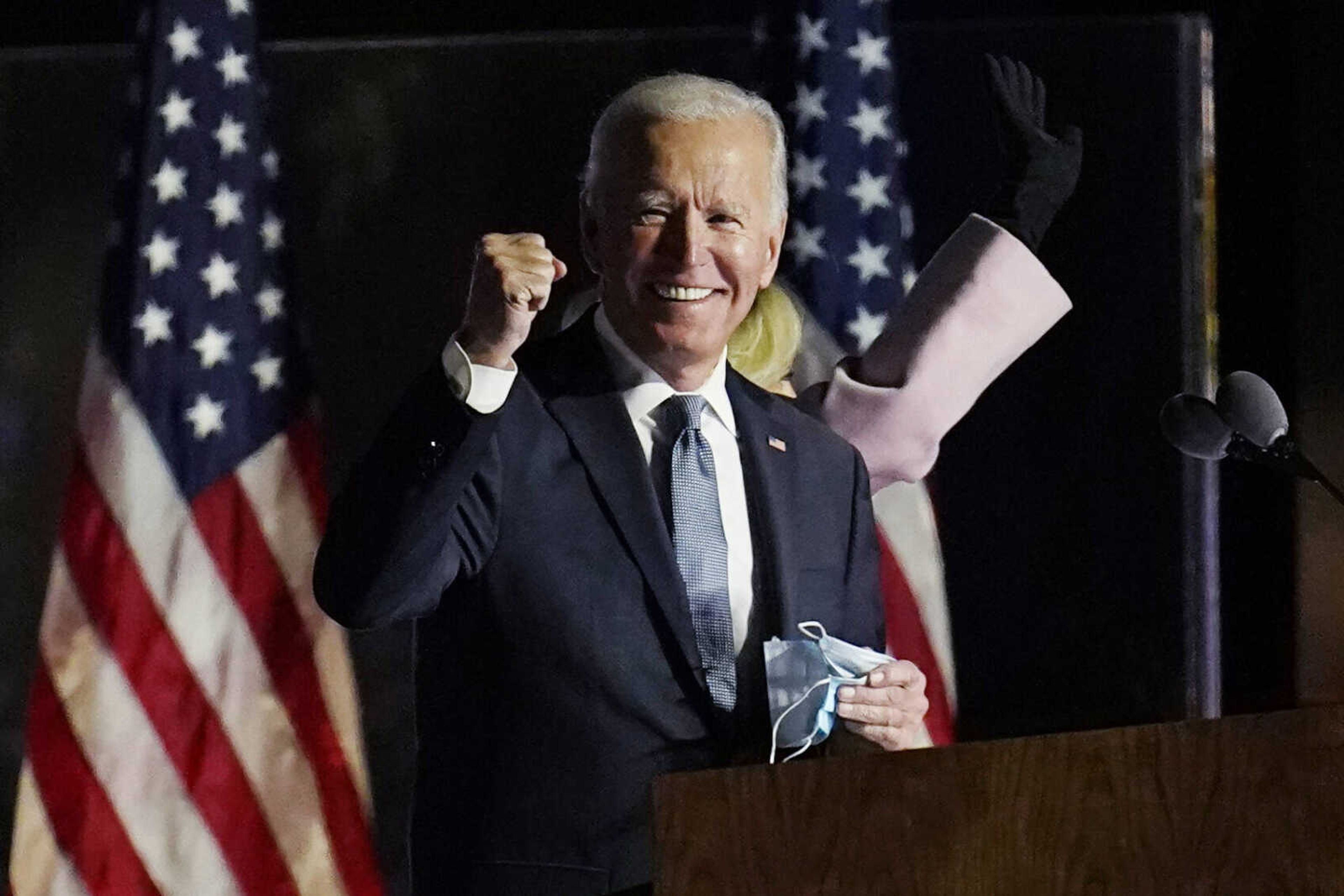 Democratic presidential candidate former Vice President Joe Biden speaks to supporters, early Wednesday, Nov. 4, 2020, in Wilmington, Del. Biden defeated President Donald Trump to become the 46th president of the United States on Saturday, positioning himself to lead a nation gripped by historic pandemic and a confluence of economic and social turmoil. (AP Photo/Paul Sancya)