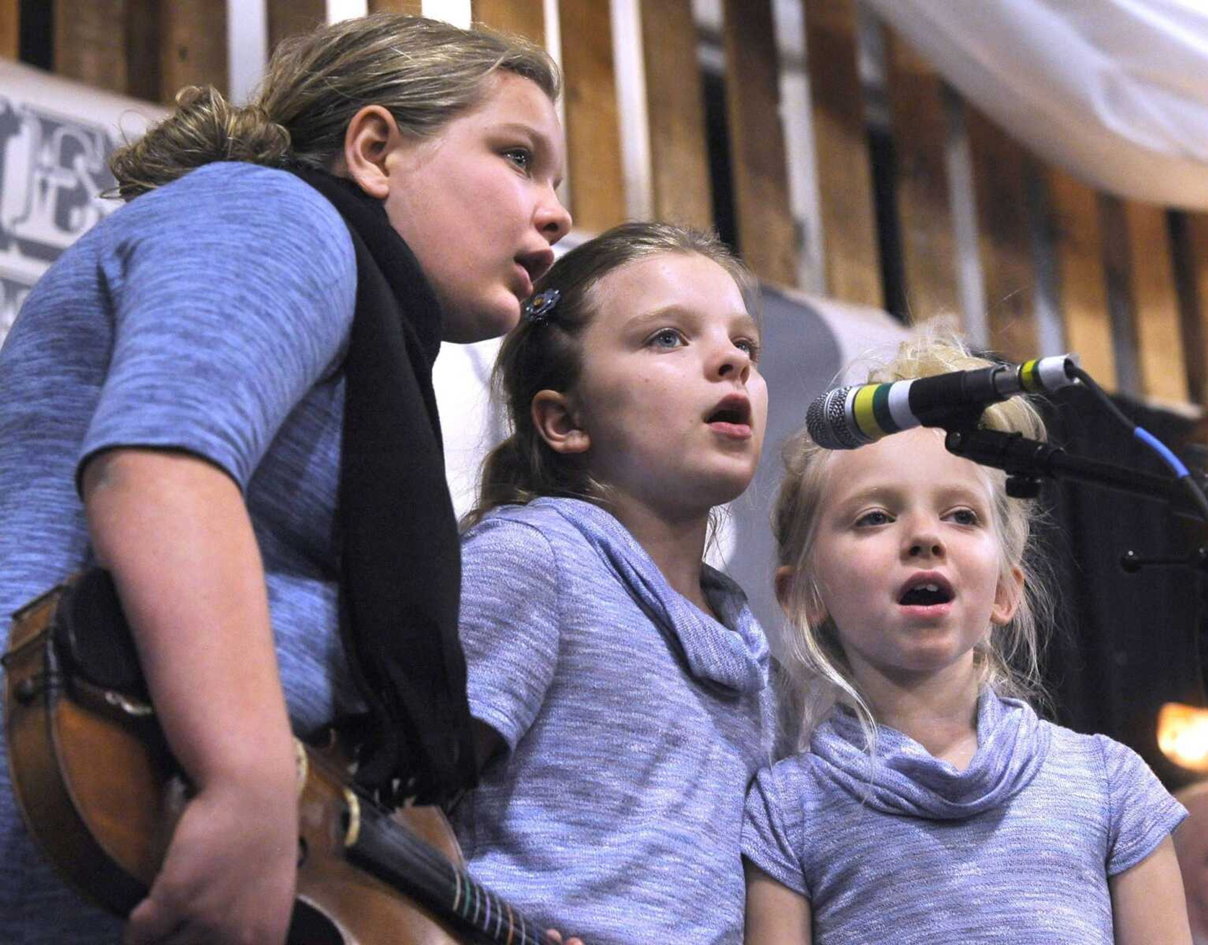 The Gipson sisters, Corley, left, Megan and Morgan, sing at the Bootheel Bluegrass Festival in January 2017 at Bavarian Halle in Fruitland.