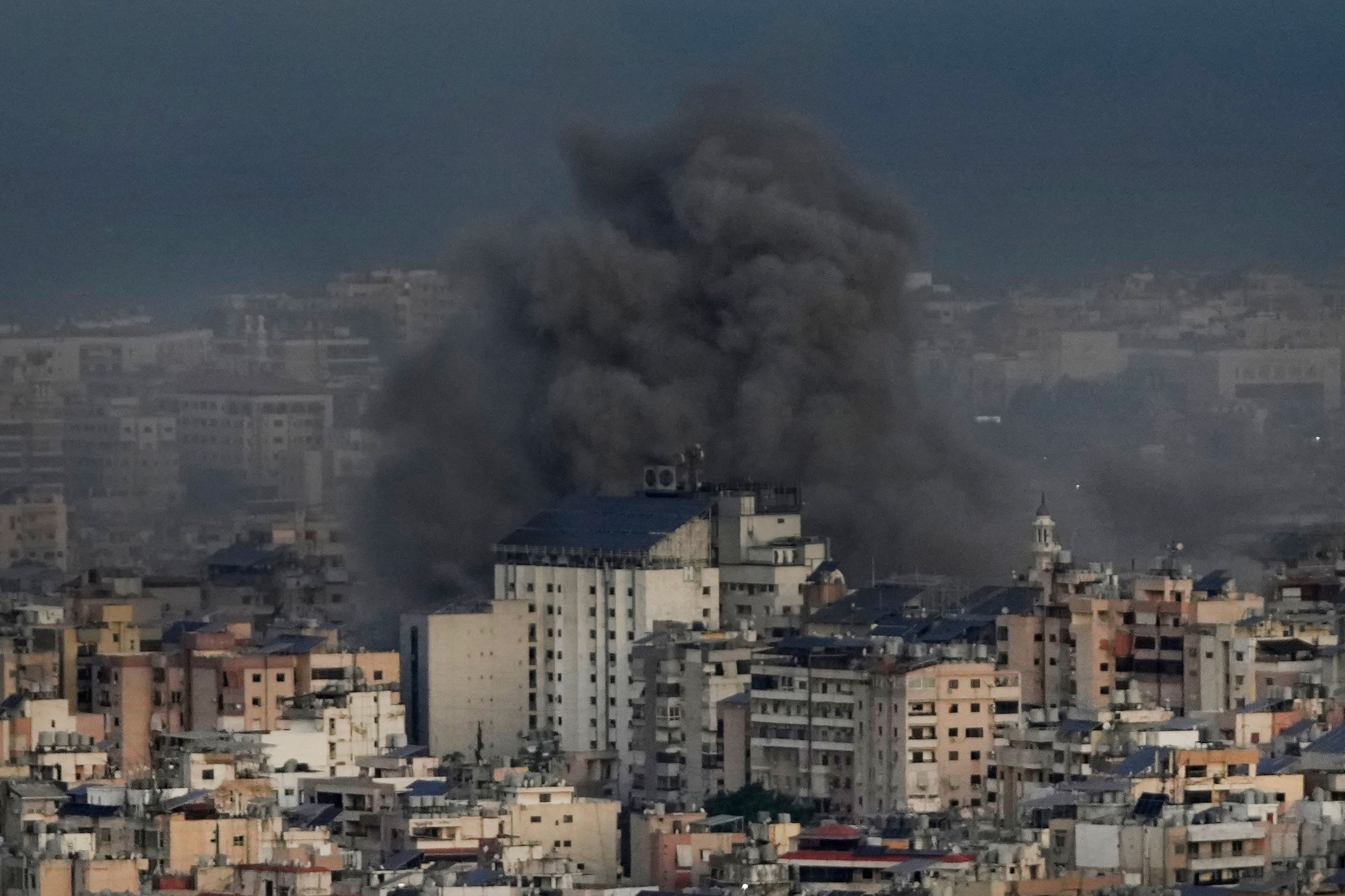 Smoke rises from Israeli airstrikes on Dahiyeh, in the southern suburb of Beirut, Lebanon, early Sunday, Oct. 20, 2024. (AP Photo/Hussein Malla)