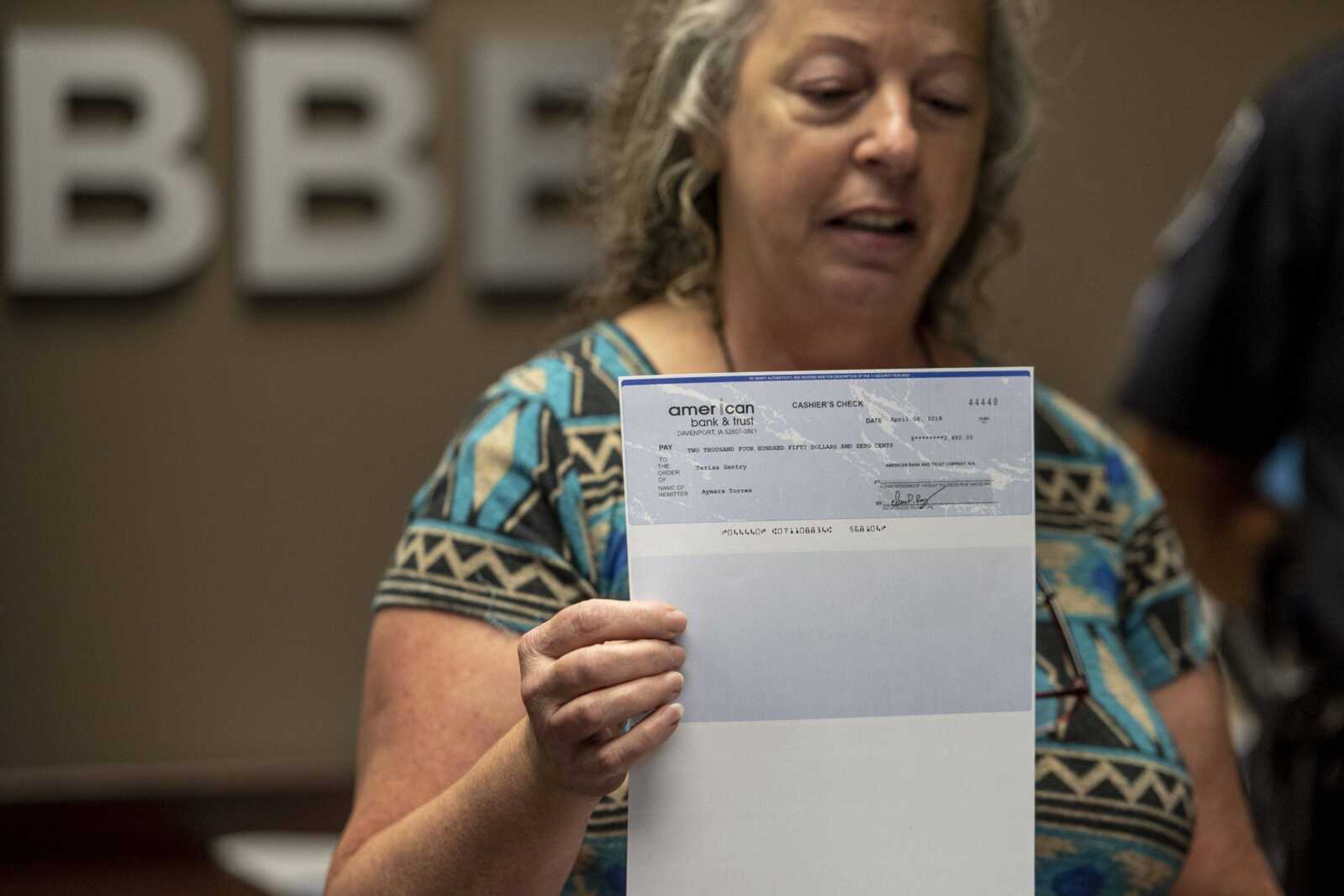 Terisa Gentry speaks about her experience with a check scam during a Better Business Bureau presentation on check fraud Wednesday in Cape Girardeau.