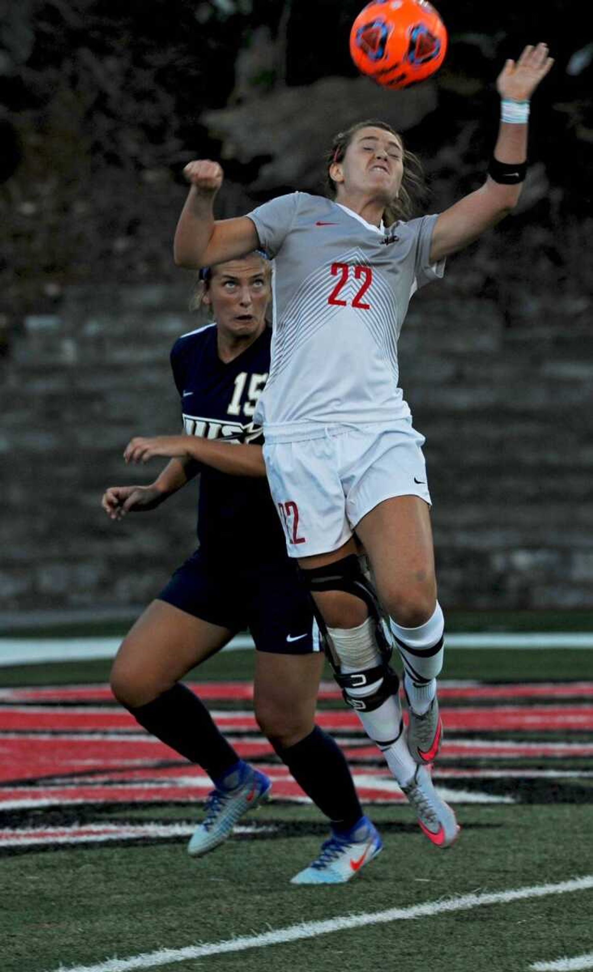 Southeast Missouri State striker Natasha Minor attempts to head the ball toward goal in front of Illinois Sringfield's Maggie Juhlin during the first half of Sunday's game.  Minor scored the tying goal in the second half to spark a Redhawk rally and a 3-1 victory in the team's home opener.