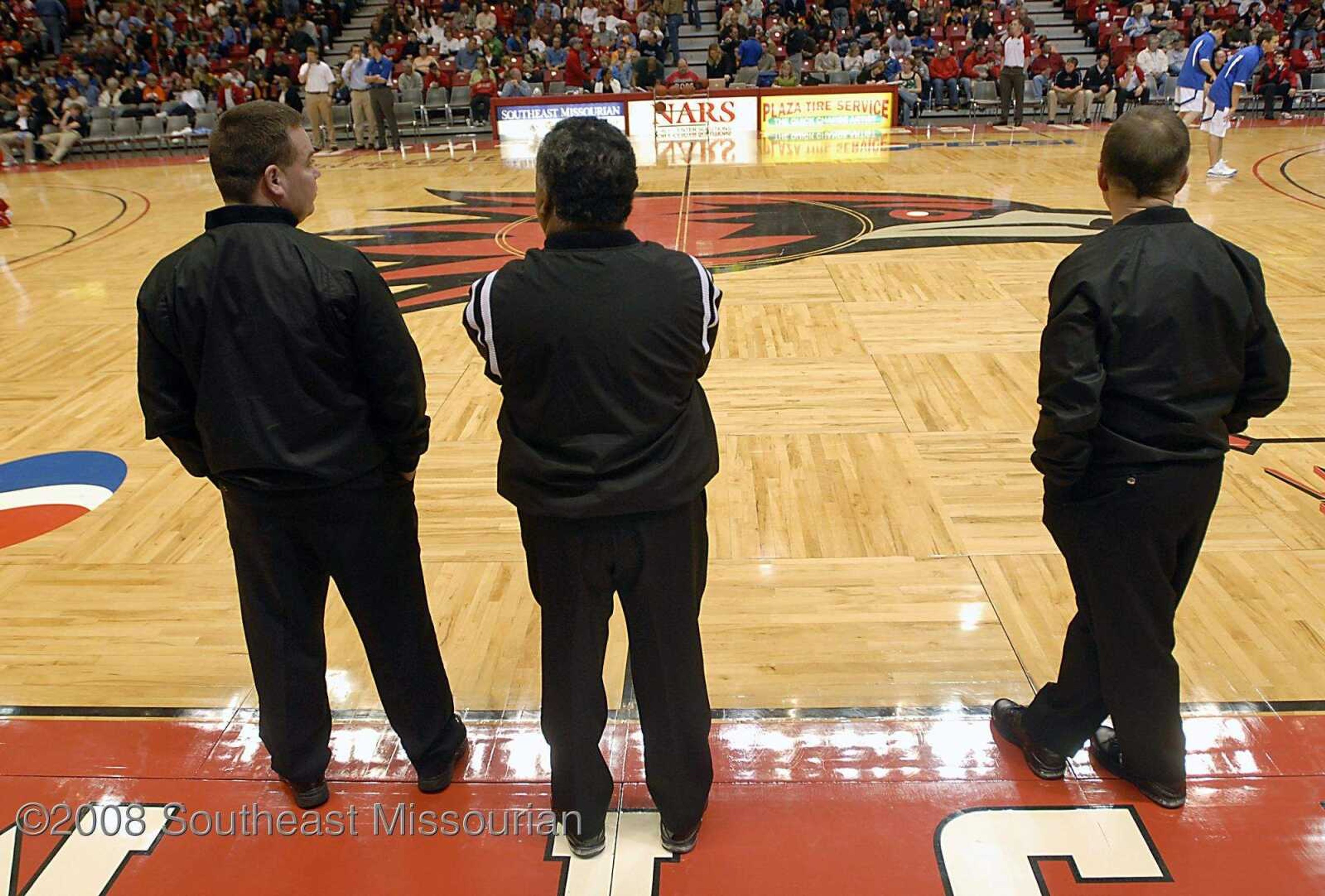 KIT DOYLE ~ kdoyle@semissourian.com
Referees watch teams warm up Monday, December 29, 2008, during the Southeast Missourian Christmas Tournament at the Show Me Center.