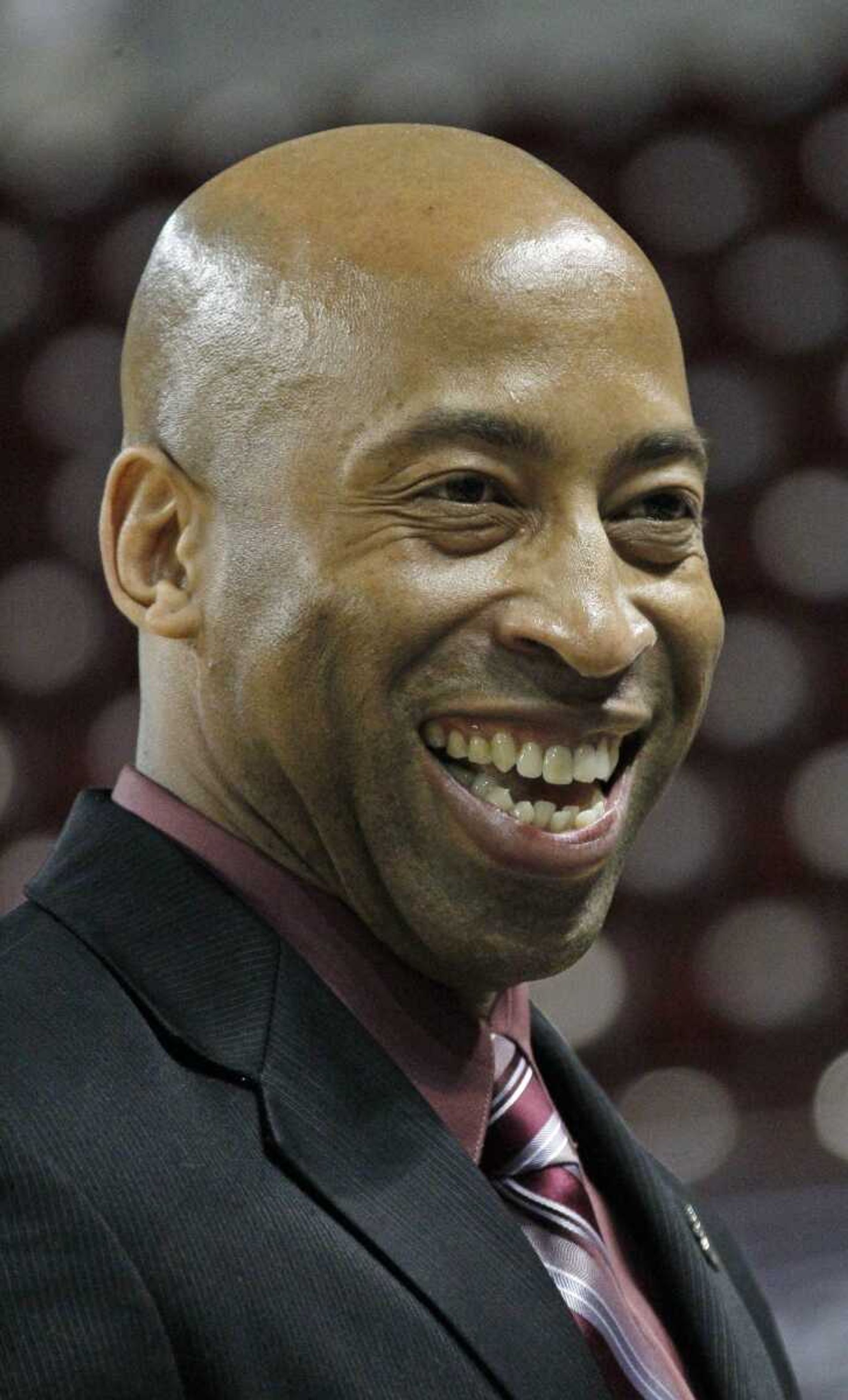 Rick Ray laughs after being introduced as Mississippi State's head basketball coach on April 2, 2012 at the school's Humphrey Coliseum in Starkville, Miss. (AP Photo/Rogelio V. Solis)