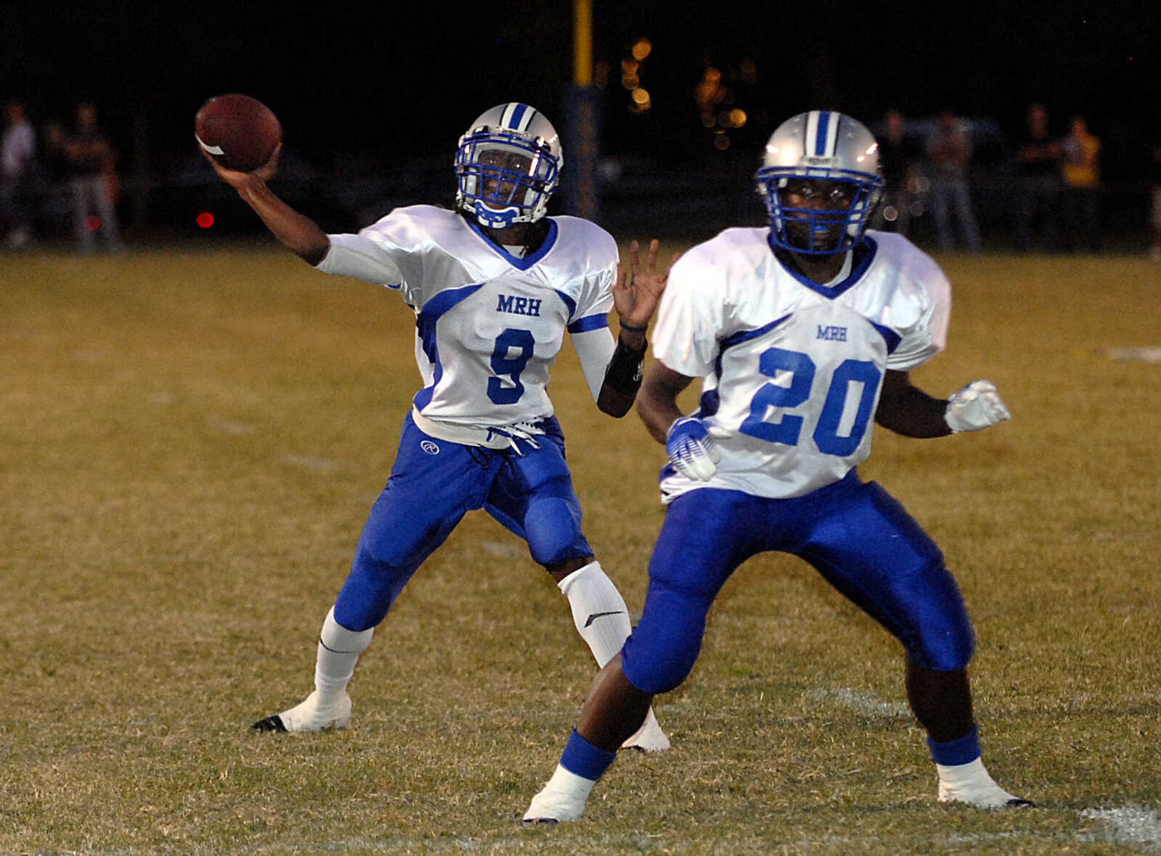 KIT DOYLE ~ kdoyle@semissourian.com
Maplewood quarterback Bryton Hobbs, left, throws for the game's first touchdown as Terron Dale protects the pocket Friday evening, September 18, 2009, in Perryville.