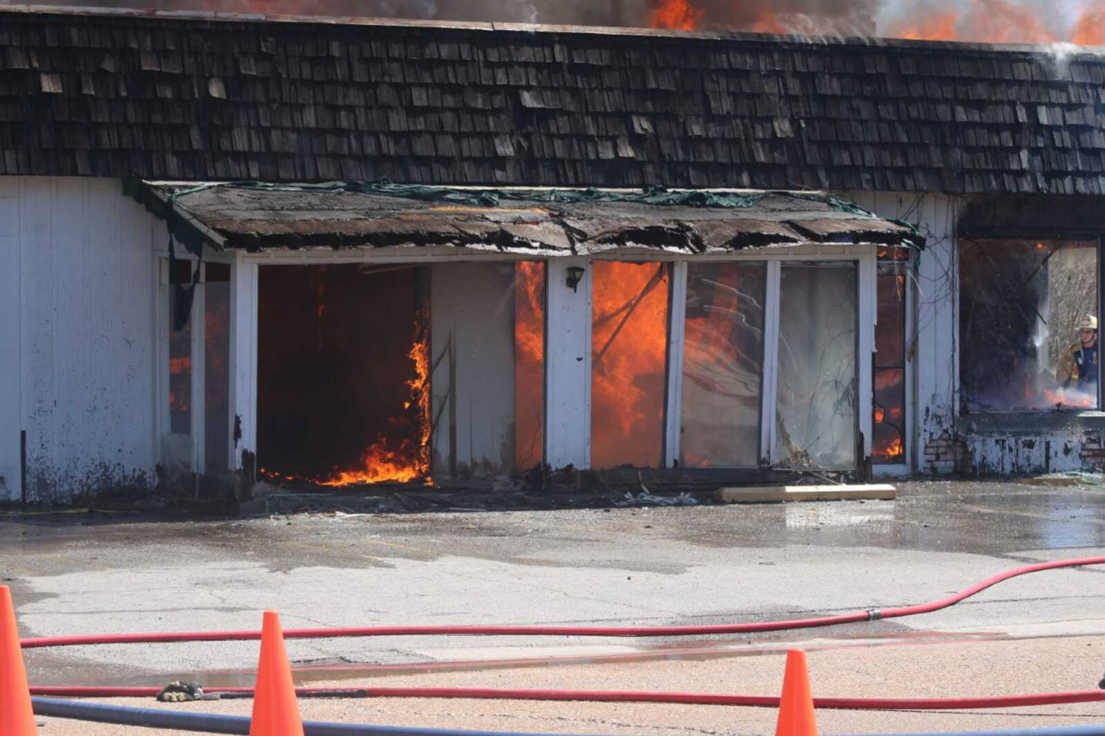 The old Sinclair gas station is demolished and burned by Chaffee, Missouri, volunteer firefighters April 2 in Chaffee.