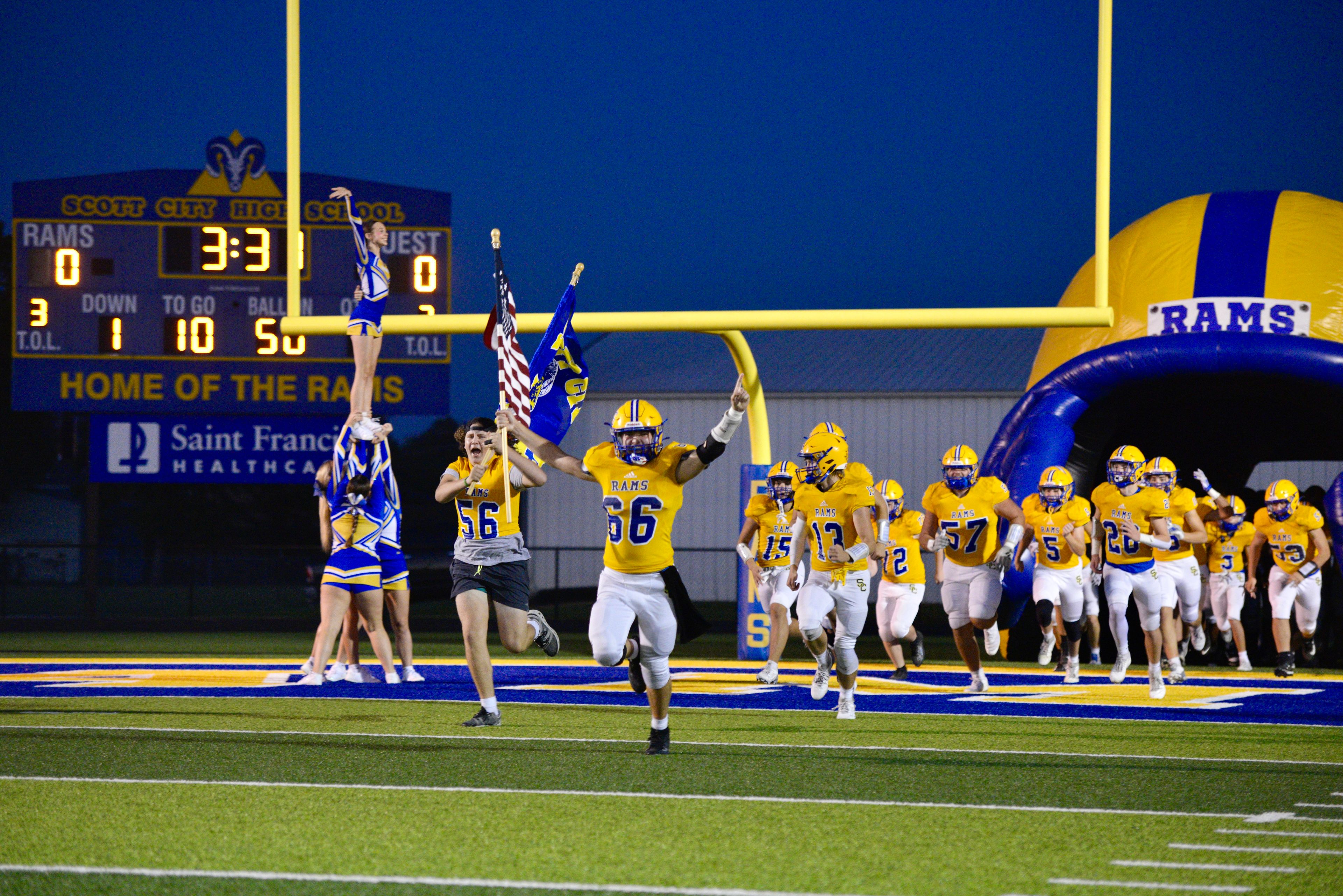 Scott City football players charge the field before the start of a game against Caruthersville on Oct. 4 in Scott City.