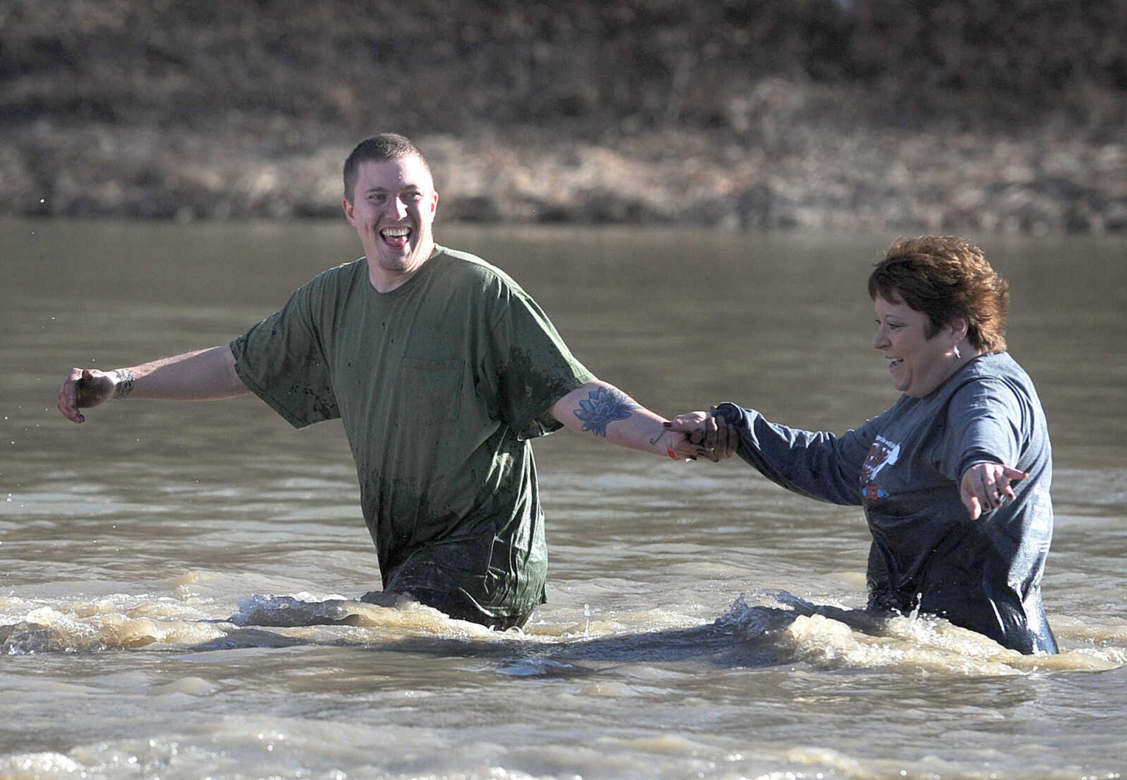 LAURA SIMON ~ lsimon@semissourian.com
People plunge into the cold waters of Lake Boutin Saturday afternoon, Feb. 2, 2013 during the Polar Plunge at Trail of Tears State Park. Thirty-six teams totaling 291 people took the annual plunge that benefits Special Olympics Missouri.