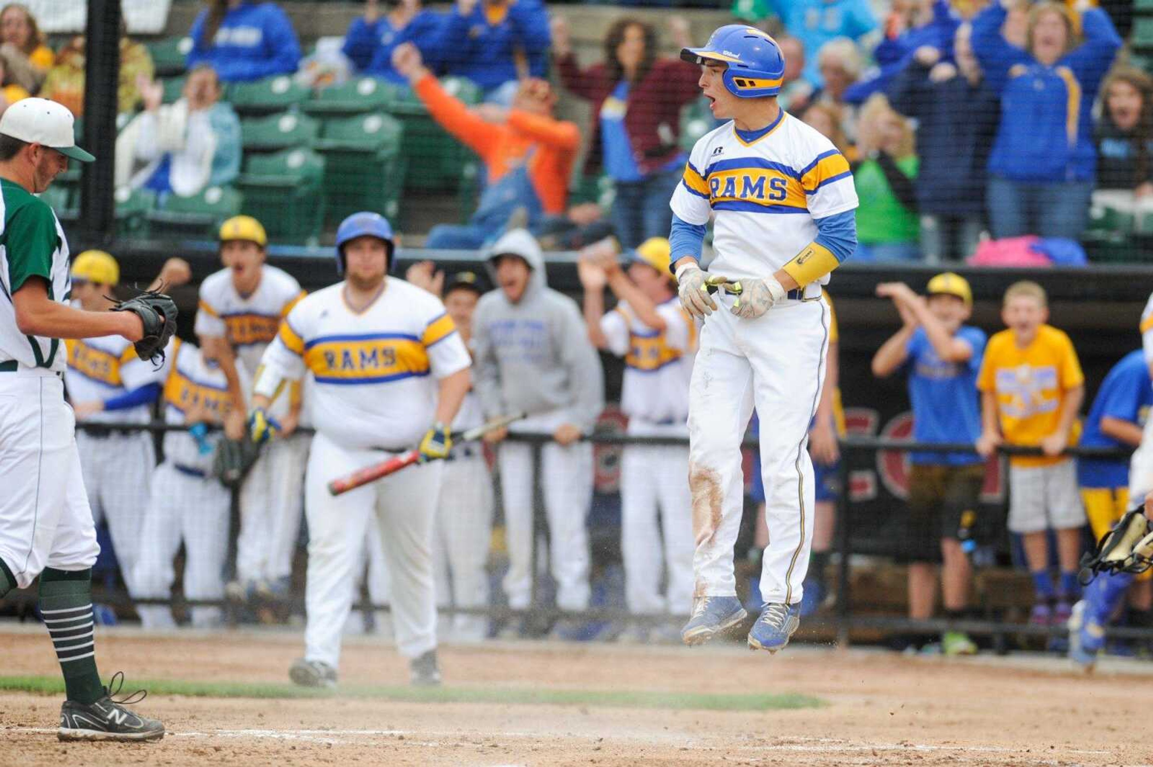 Scott City's Trent Pobst celebrates after scoring in the first inning against Warsaw during a Class 3 semifinal Monday, June 1, 2015 in O Fallon, Missouri. (Glenn Landberg)