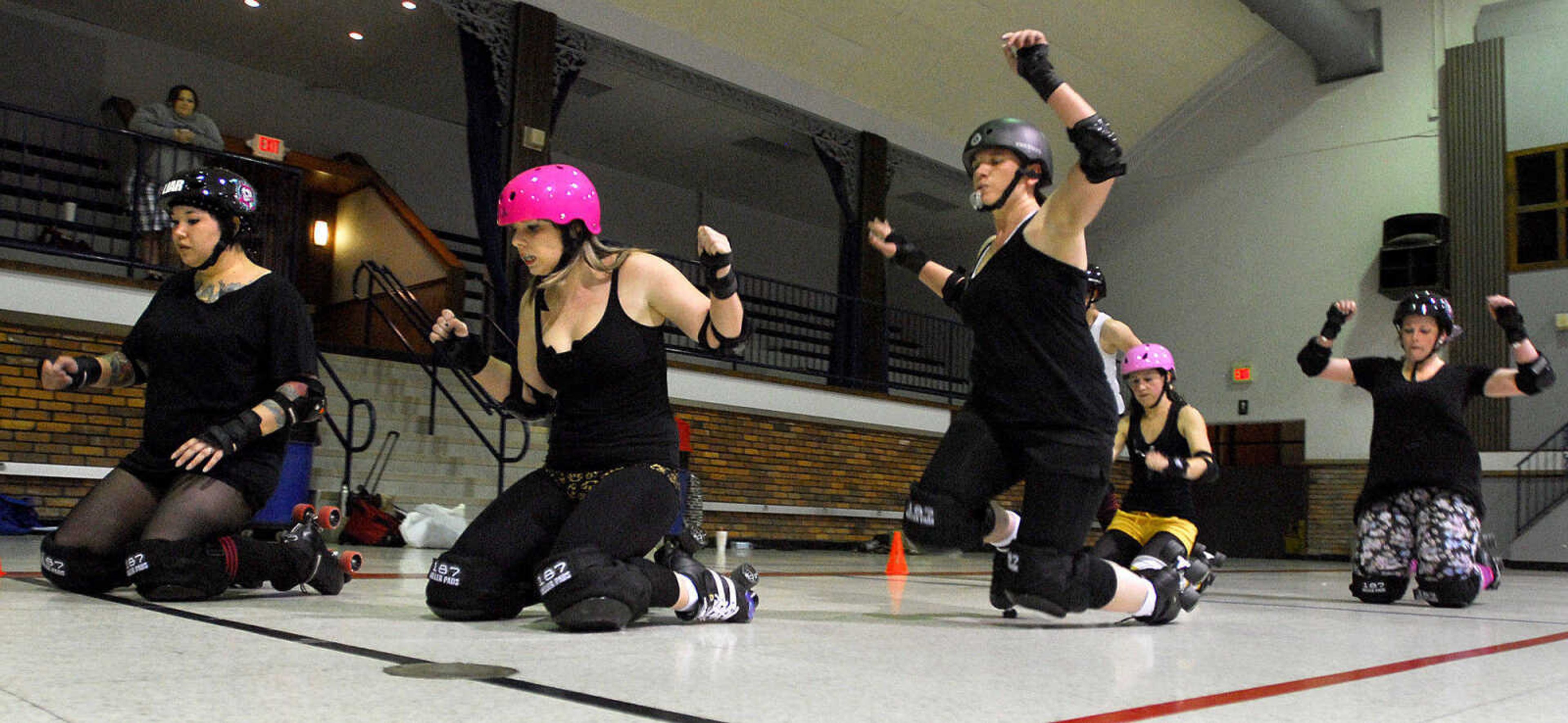 LAURA SIMON~lsimon@semissourian.com
Members of the Cape Girardeau Roller Girls practice their falls Monday, May 24, 2010 at the A.C. Brase Arena Building.