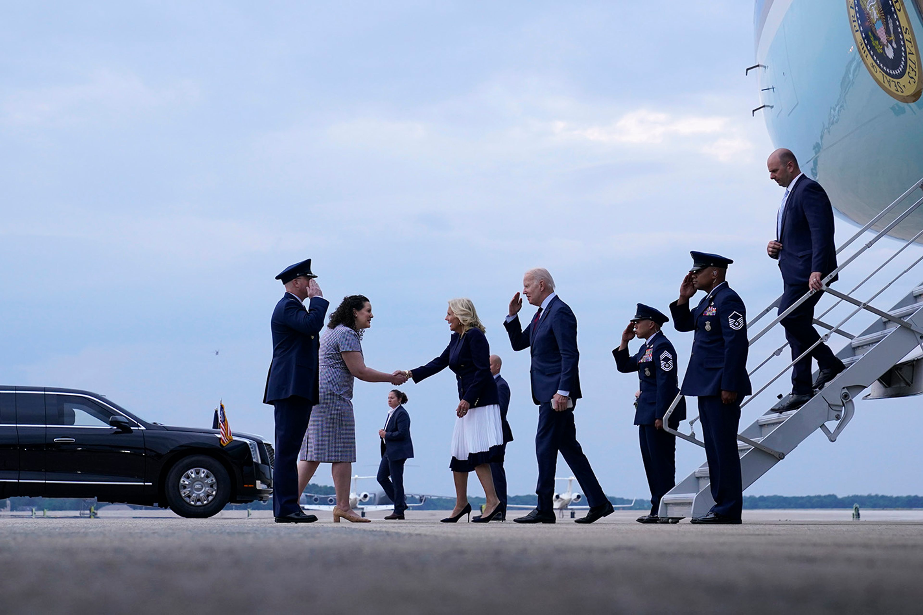 President Joe Biden and first lady Jill Biden walk down the steps of Air Force One at Andrews Air Force Base, Md., and greet Col. William McDonald, Vice Commander, 89th Airlift Wing and his wife Diana, Friday, June 9, 2023, after a visit to North Carolina. 