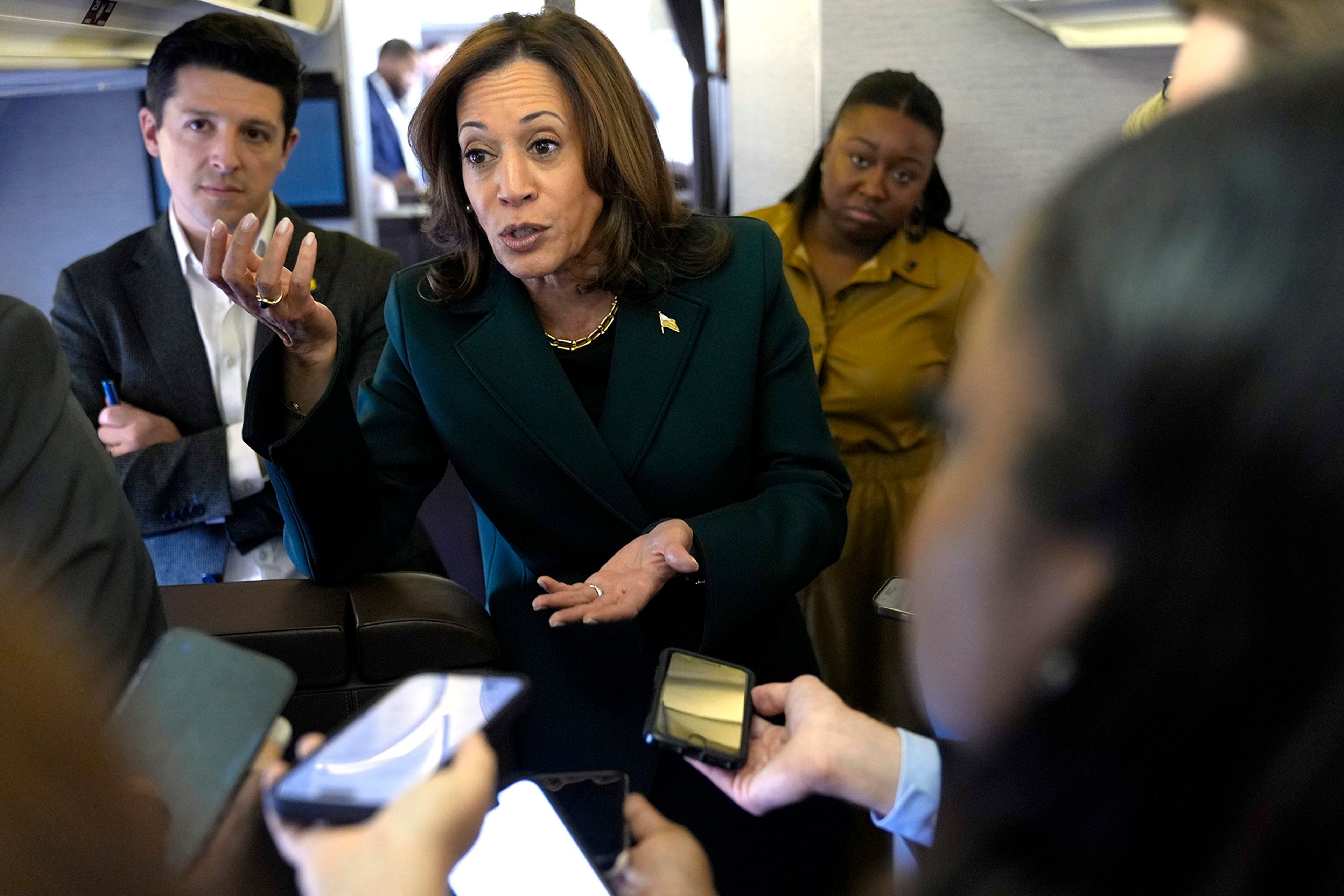 Democratic presidential nominee Vice President Kamala Harris speaks with members of the press on board Air Force Two at Philadelphia International Airport, Monday, Oct. 21, 2024, in Philadelphia, before departing to Michigan. 