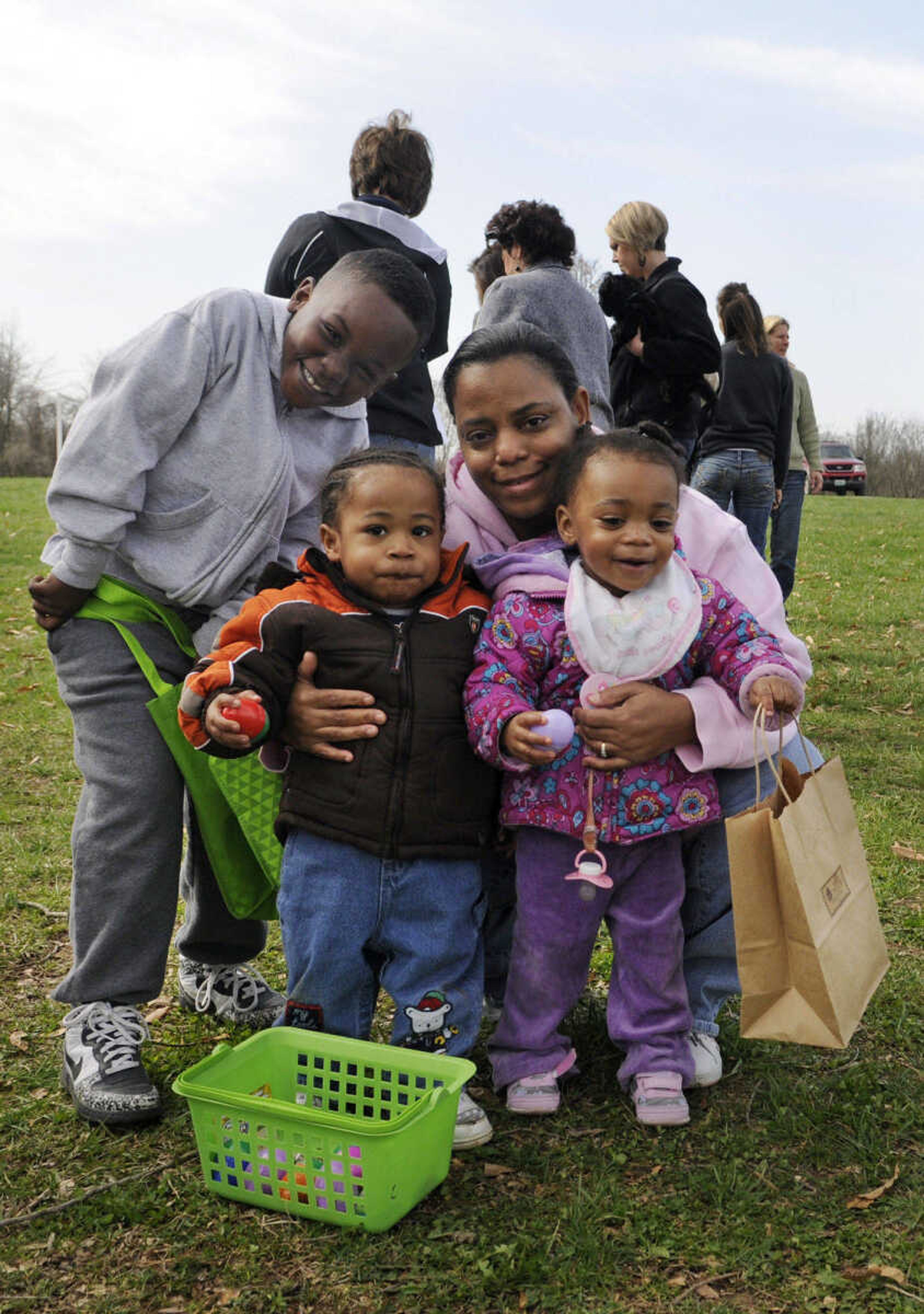 KRISTIN EBERTS ~ keberts@semissourian.com

Darrien Thomas, 7, brother Keyton Thomas, 2, KeShaunna Jones, 1, and grandmother Patricia Moore display the eggs they collected after the Cape Girardeau Parks and Recreation  easter egg hunt at Kiwanis Park in Cape Girardeau, Mo., on Saturday, March 27, 2010.