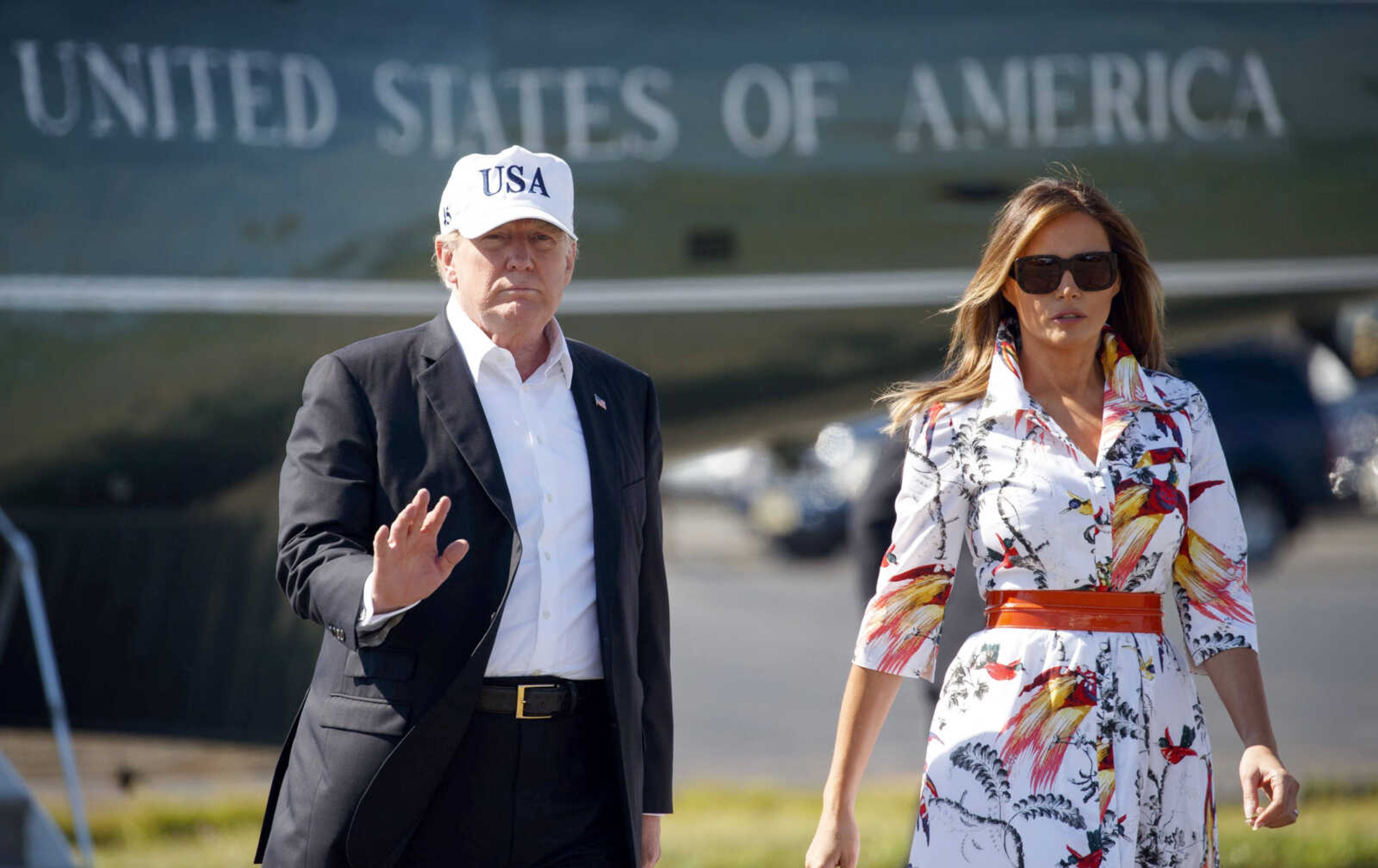 President Donald Trump and first lady Melania Trump walk from Marine One to board Air Force One on Sunday at Morristown Municipal Airport in Morristown, New Jersey, en route to Washington from Trump National Golf Club in Bedminster, New Jersey.