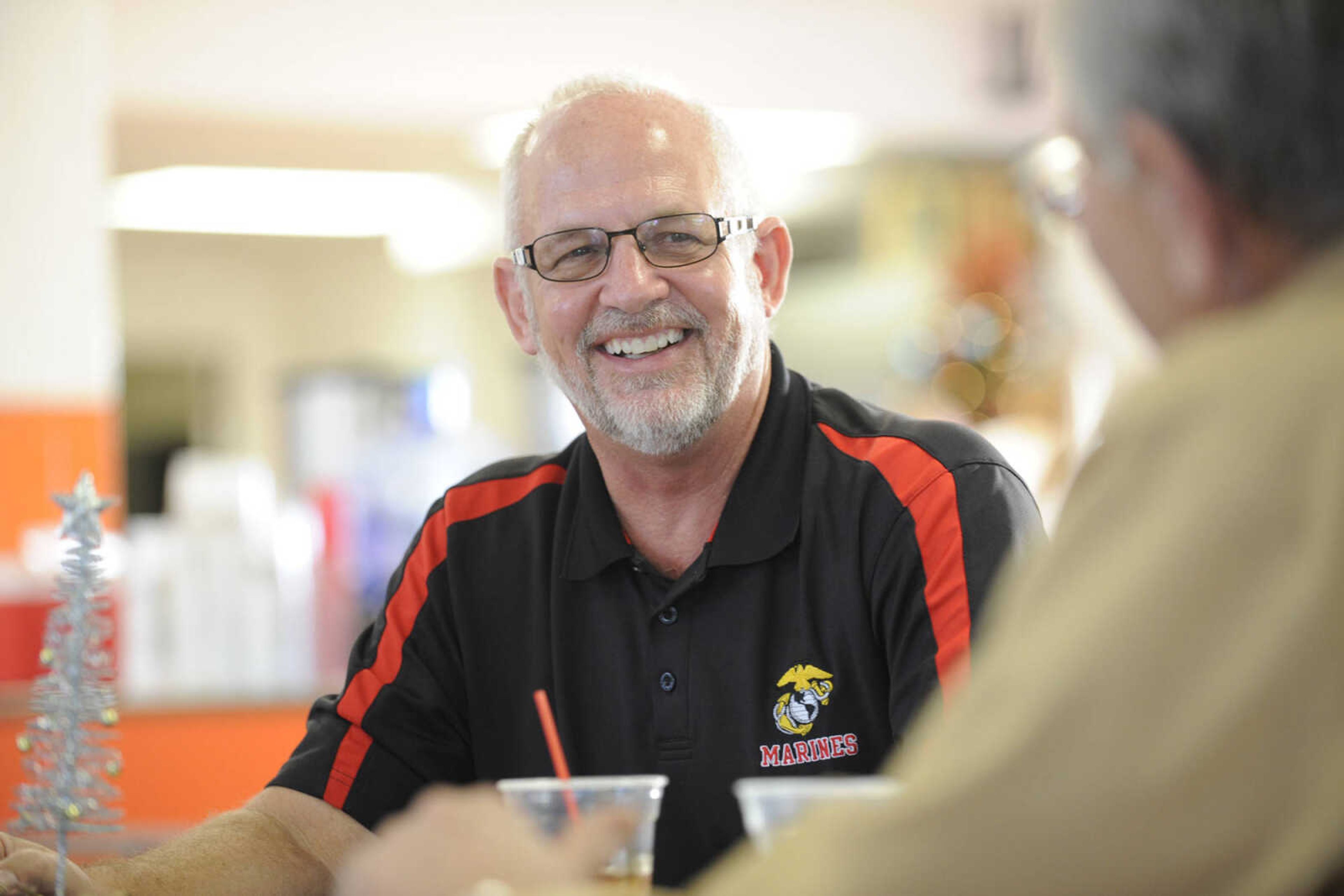 GLENN LANDBERG ~ glandberg@semissourian.com

Jim Maevers, a member of the Marine Corps League  enjoys a meal during the Student Santas Christmas dinner before handing out toys as part of the Toy for Tots Foundation Thursday, Dec. 25, 2014 at Central Junior High School.