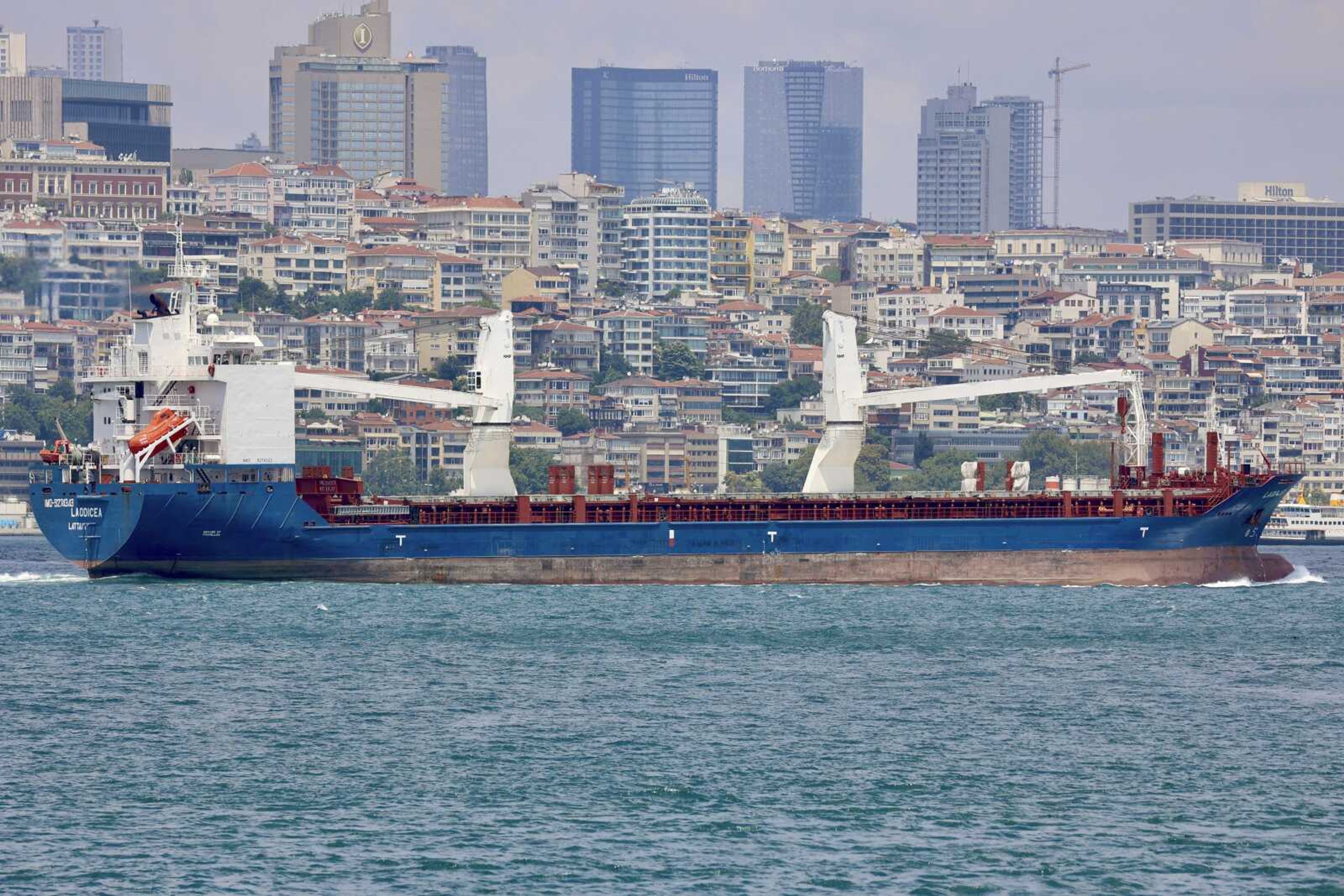 The cargo ship Laodicea sails through the Bosphorus Strait on July 7 in Istanbul, Turkey. An Associated Press investigation shows the ship, owned by the Syrian government, is part of an extensive Russian-run smuggling operation that has been hauling stolen Ukrainian grain from ports in occupied Crimea to customers in the Middle East.