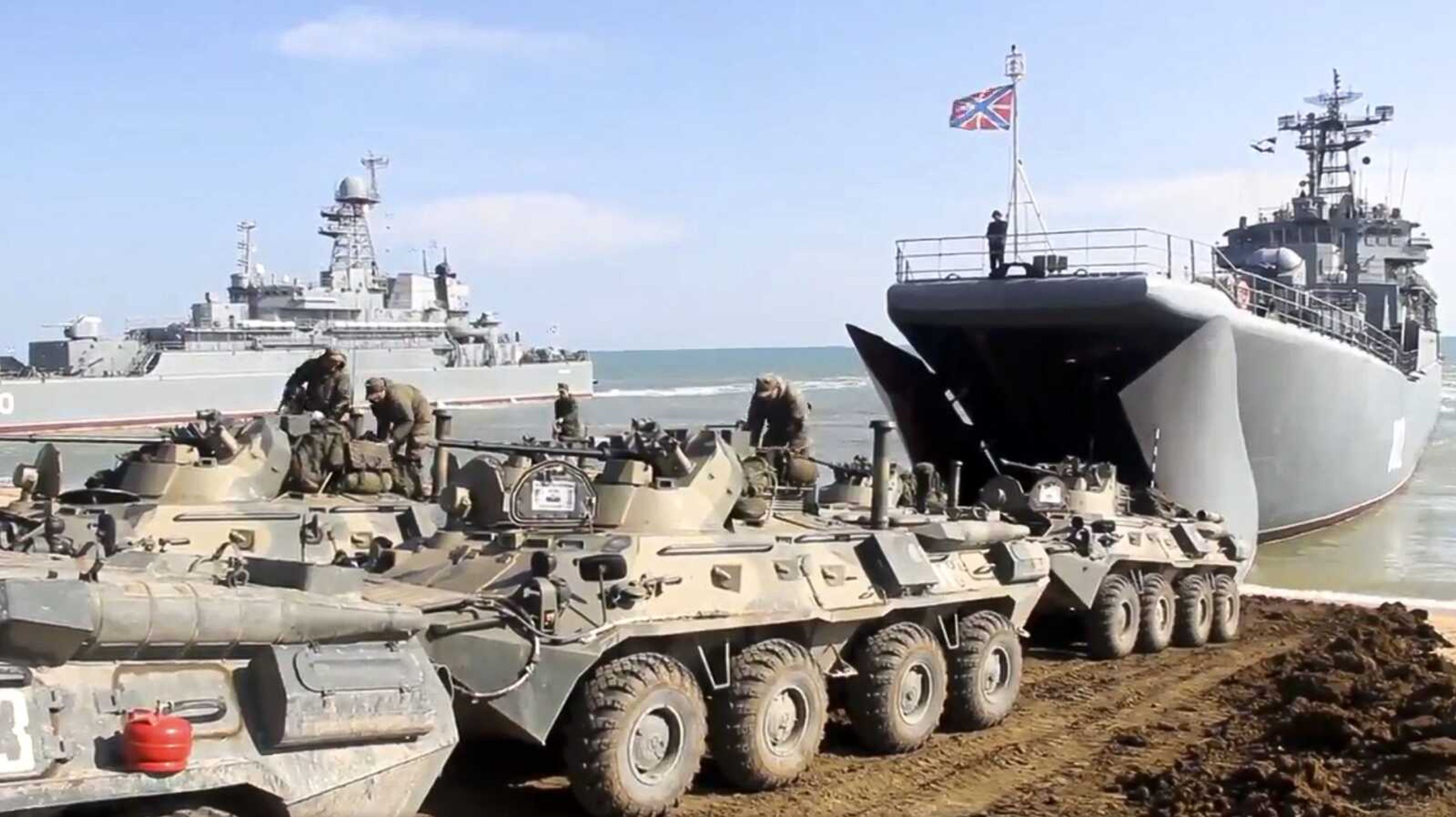 This handout photo taken from a video released Friday by Russian Defense Ministry Press Service shows Russian military's armored vehicles roll into landing vessels after drills in Crimea. Russian Defense Minister Sergei Shoigu on Thursday ordered troops back to their permanent bases after a massive military buildup that caused Ukrainian and Western concerns.