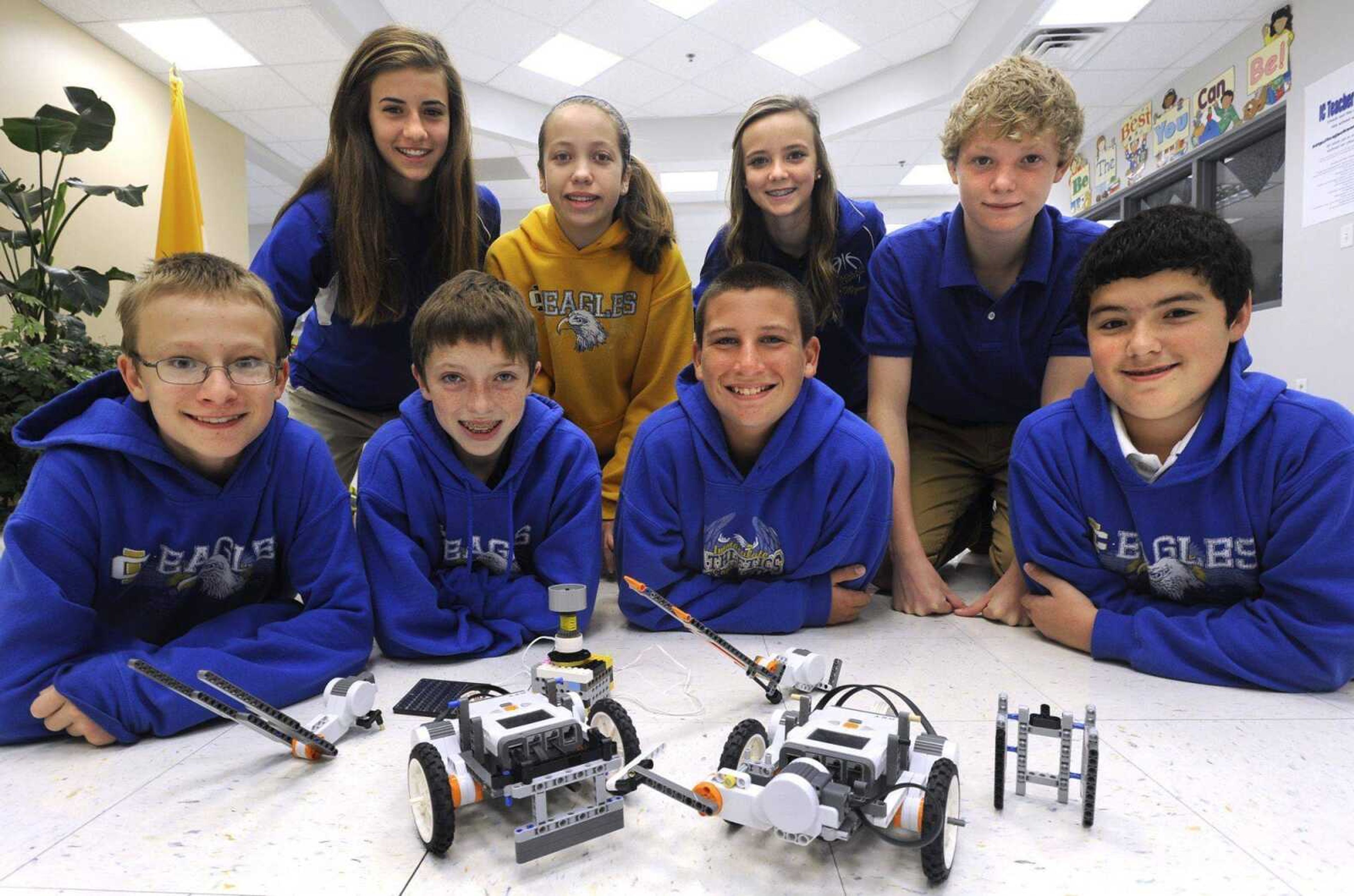 The LEGO robotics team at Immaculate Conception School in Jackson gathers for a photo, from left, front row: Steven Peters, Benton Keran, Parker Nugent and Hayden Morrill; back row: Allison Bray, Megan Engelen, Megan Jansen and Matt Gibbs. (Fred Lynch)