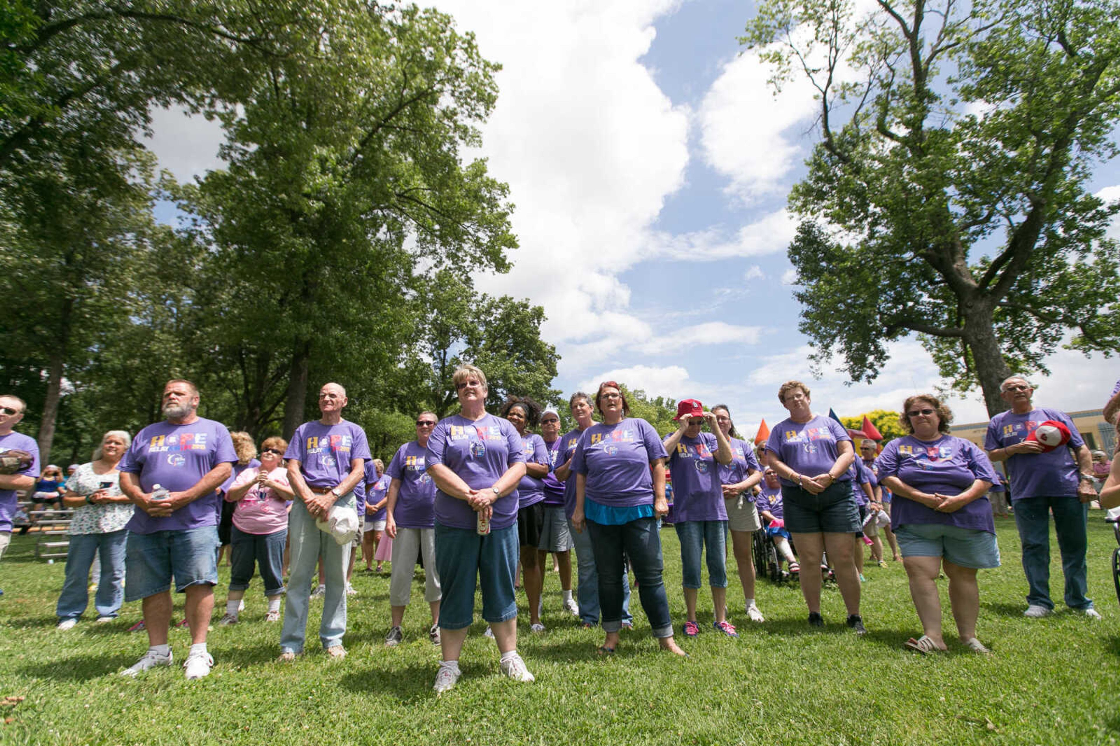 GLENN LANDBERG ~ glandberg@semissourian.com

Cancer survivors stand to be honored during the opening ceremony of the Relay for Life of Cape Girardeau County fundraiser at Arena Park, Saturday, June 13, 2015.