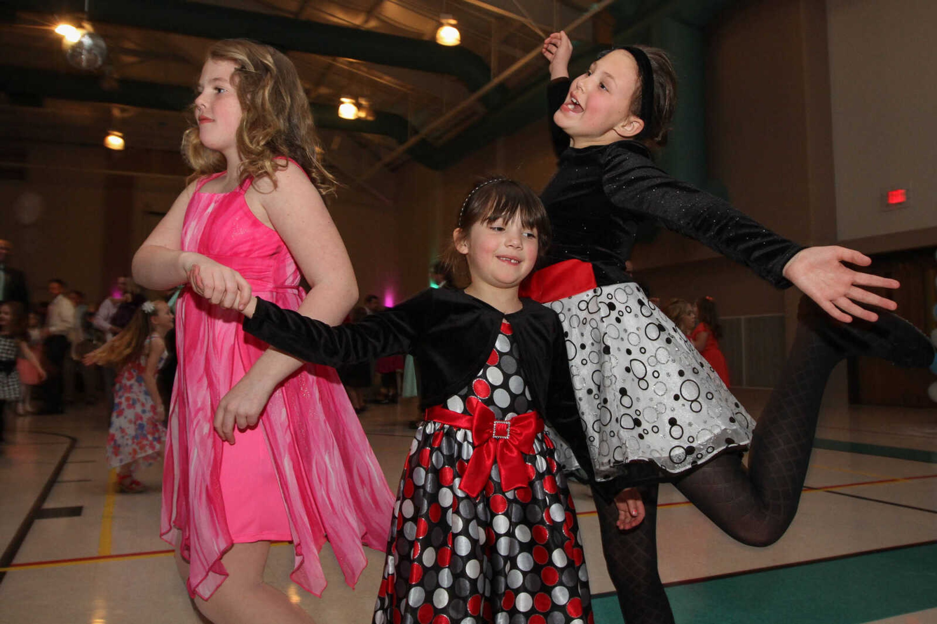 GLENN LANDBERG ~ glandberg@semissourian.com


Kadence Crawford, left, Maggie and Katy St. John show off their moves during the 7th annual Father/Daughter Dance Saturday, Feb. 21, 2015 at the Osage Centre. This year's theme was Frozen Dreams.