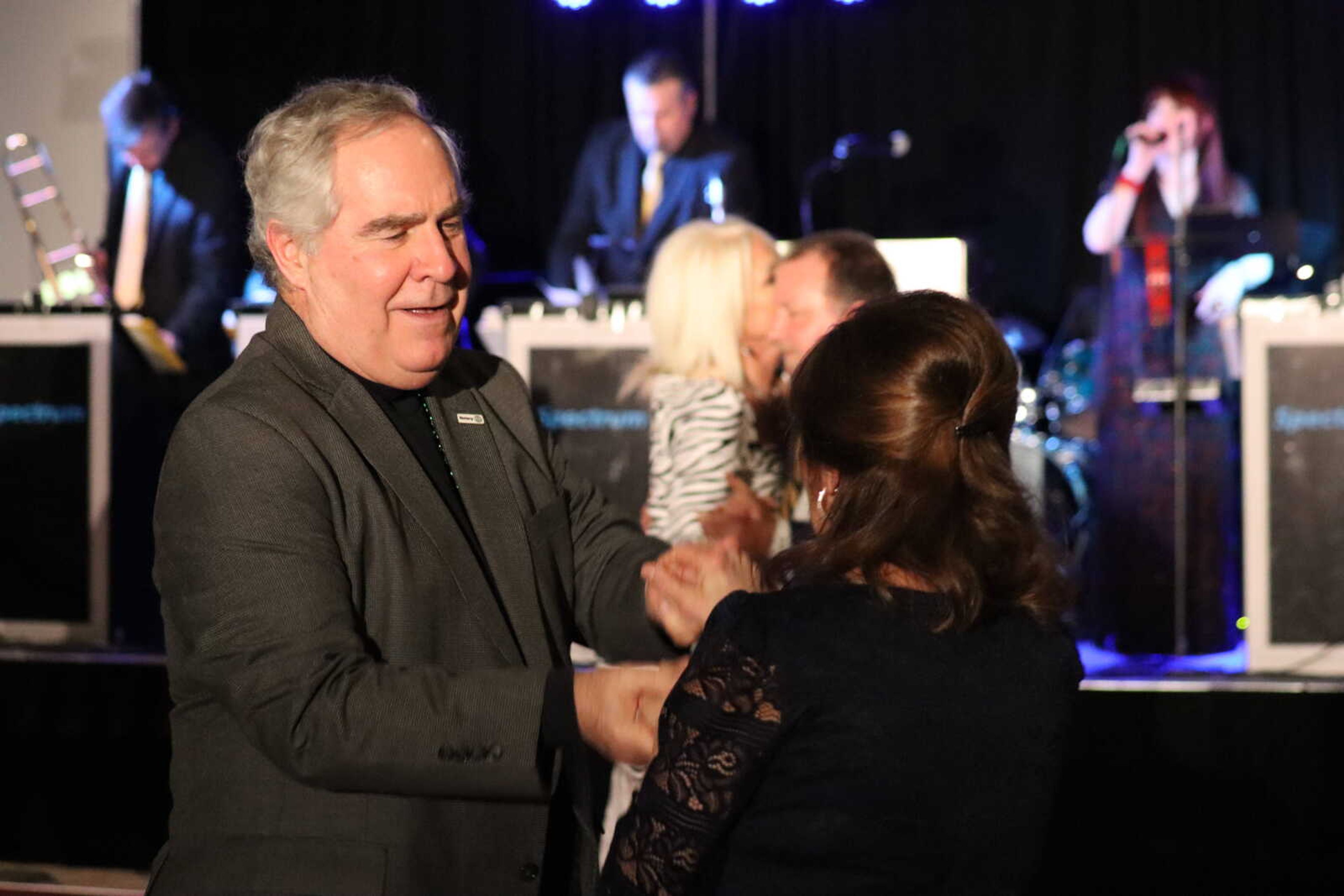 Attendees speed up the pace of their dance on the floor.