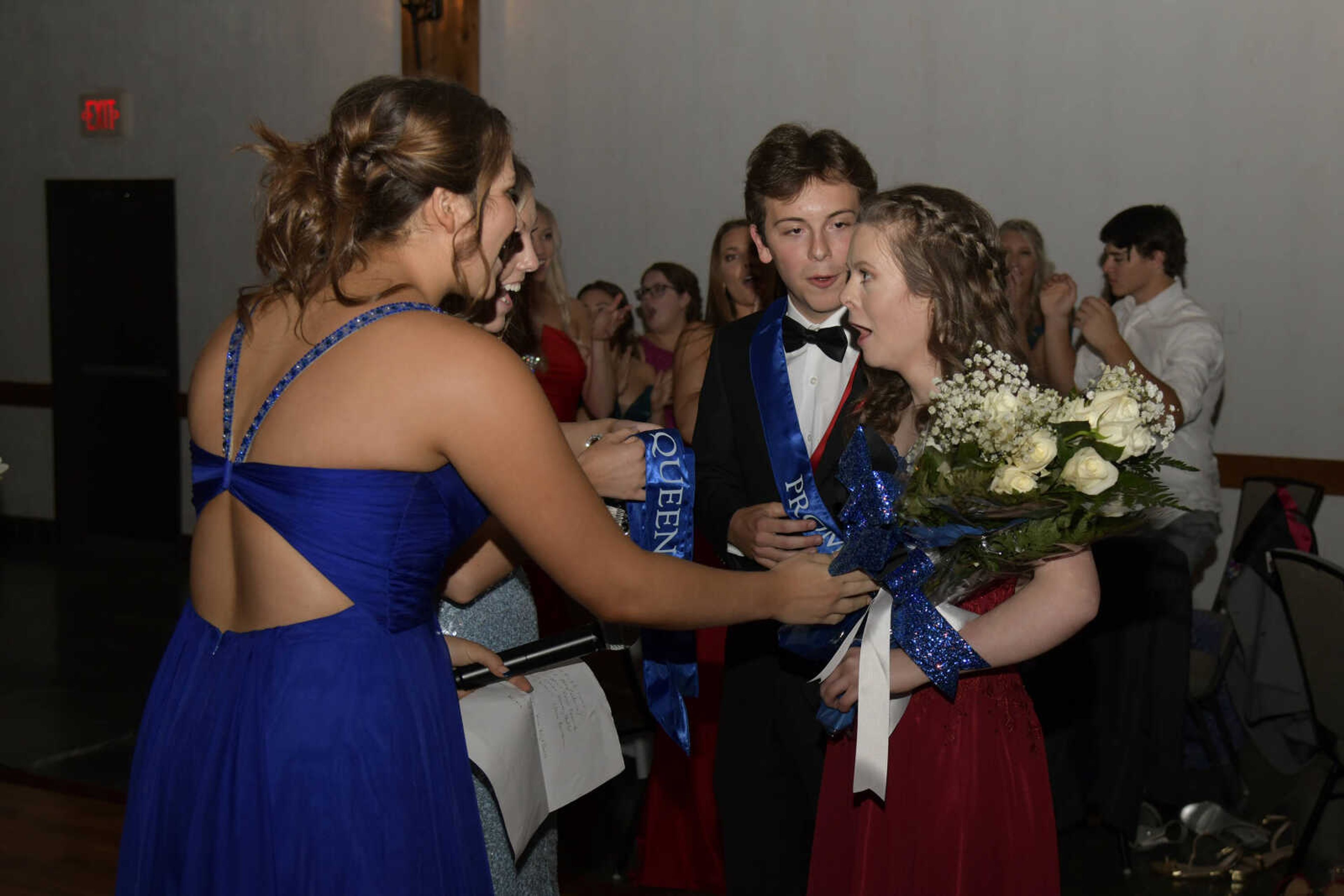 Ashlyn Baer and Nick Williams react to being named prom king and queen during Notre Dame's prom at Bavarian Halle in Jackson on Friday, April 30, 2021.