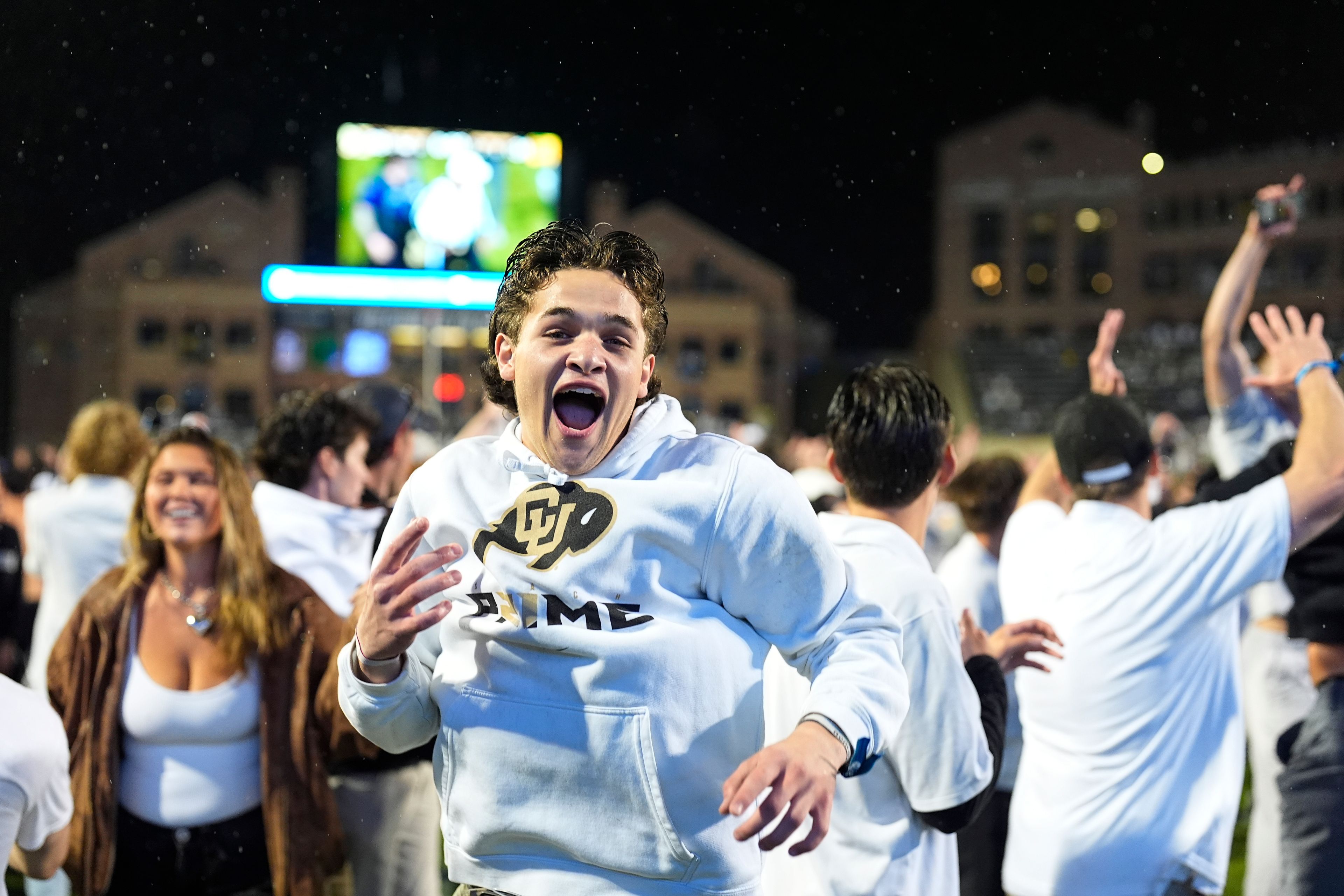 FILE - Colorado fans storm the playing field after Colorado's overtime victory over Baylor in an NCAA college football game Saturday, Sept. 21, 2024, in Boulder, Colo. (AP Photo/David Zalubowski, File)