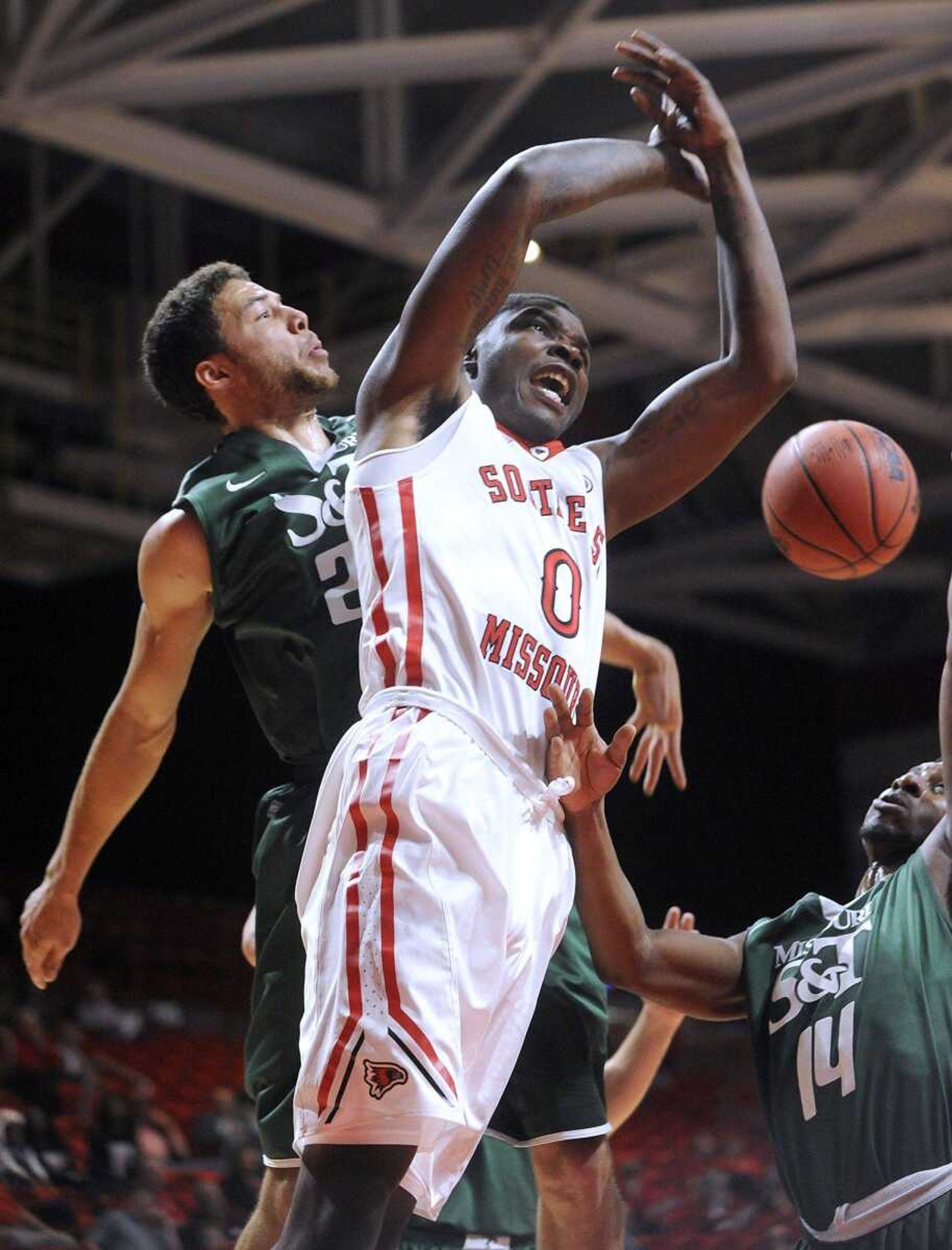 FRED LYNCH ~ flynch@semissourian.com  A shot by Southeast Missouri State's Jaylin Stewart is knocked away by Missouri S&T's B.J. McLaughlin  during the first half Saturday, Nov. 7, 2015 at the Show Me Center.