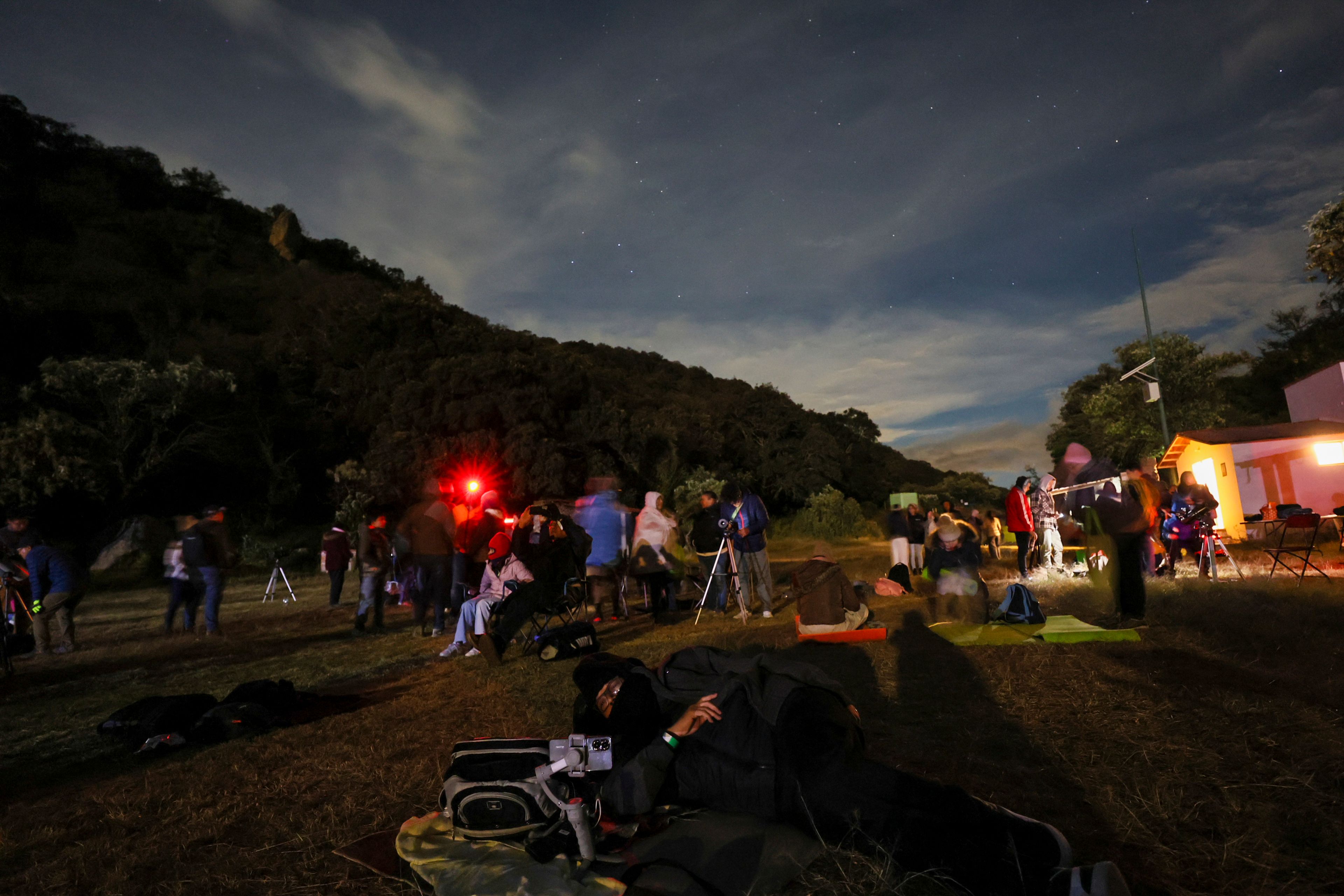 People attend a stargazing and comet-watching gathering at Joya-La Barreta ecological park in Queretaro, Mexico, Saturday, Oct. 19, 2024. (AP Photo/Ginnette Riquelme)