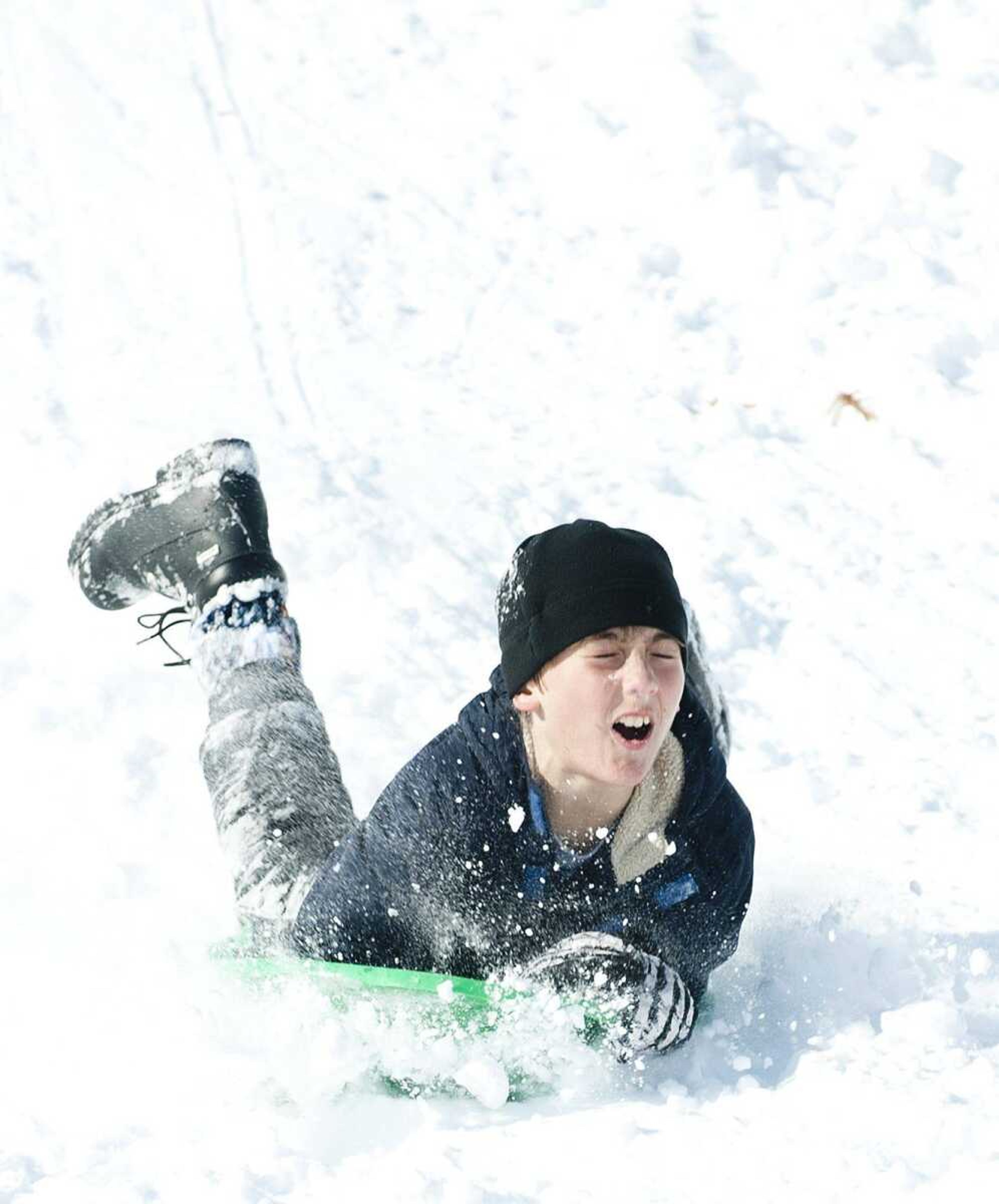 Isaac LeGrand, 9, hits a bump while sledding Dec. 7 at Capaha Park in Cape Girardeau. A federal agency is predicting colder-than-normal temperatures this winter. (ADAM VOGLER)