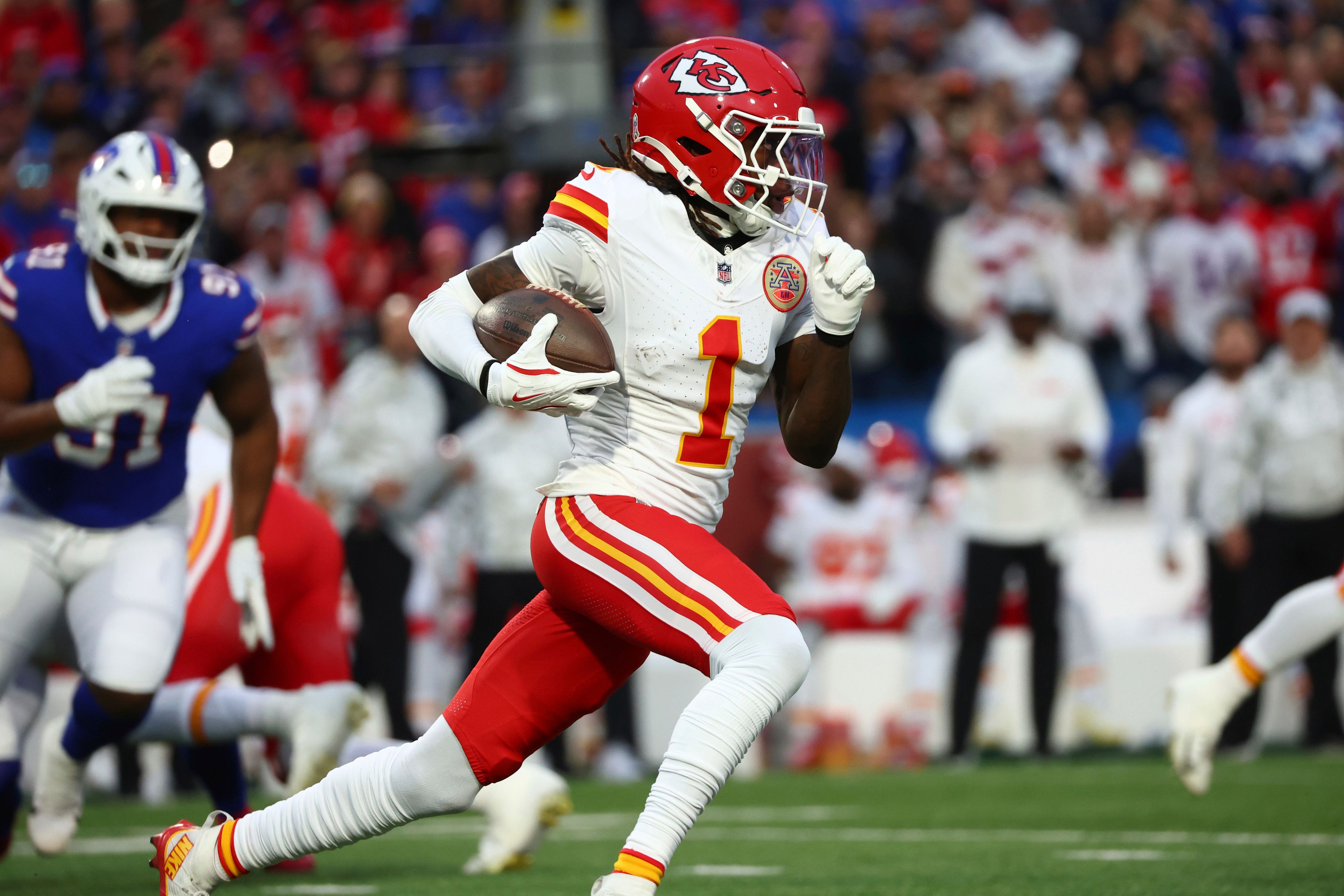 Kansas City Chiefs wide receiver Xavier Worthy (1) runs with the ball during the first half of an NFL football game against the Buffalo Bills Sunday, Nov. 17, 2024, in Orchard Park, N.Y. (AP Photo/Jeffrey T. Barnes)