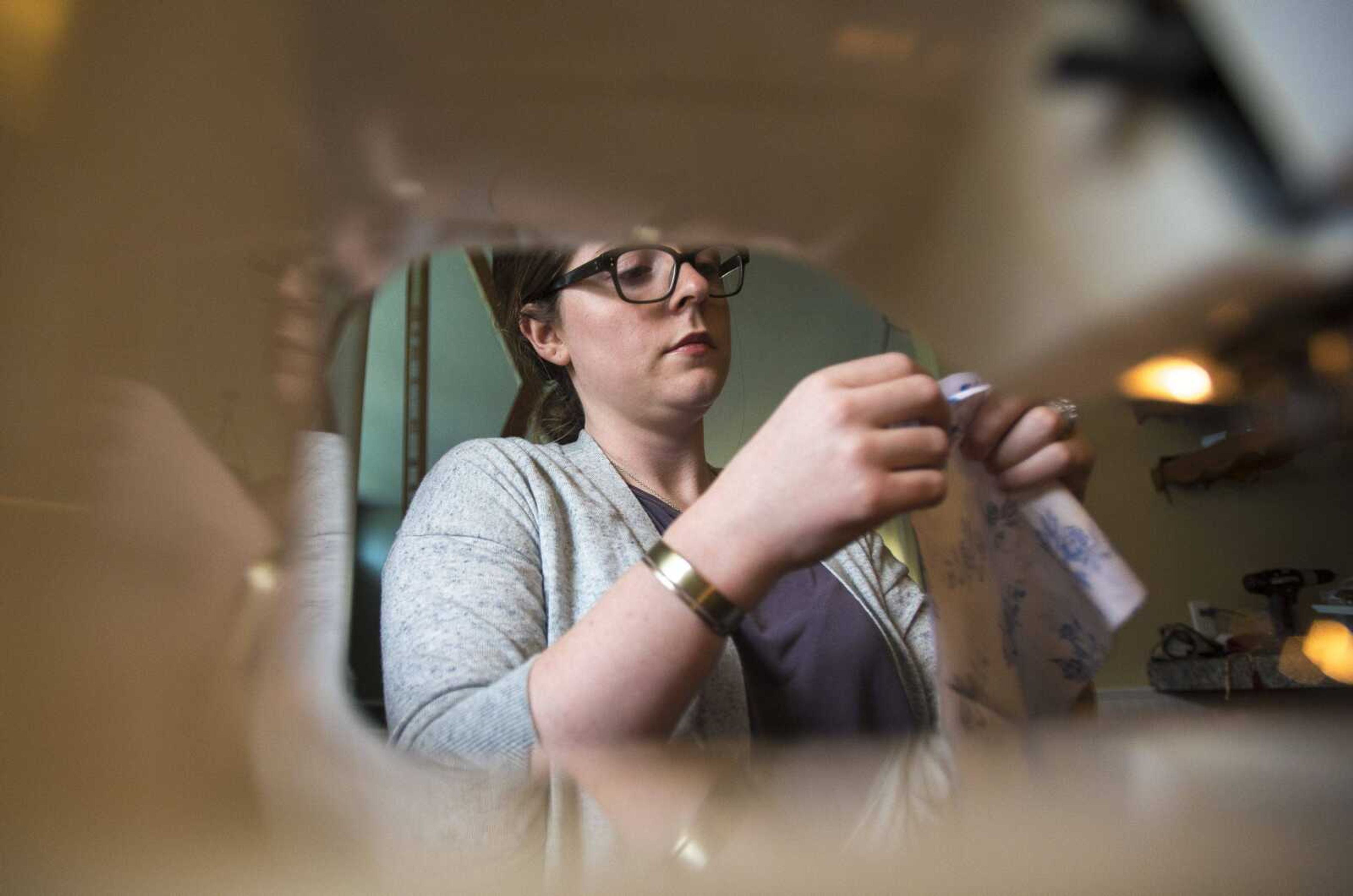 Emily Colbert works on her grandmother's sewing machine in her kitchen Monday, Oct. 23, 2017 in Cape Girardeau. Colbert has a fashion blog called Rag + Relic where she sells items she makes from her sewing machine.