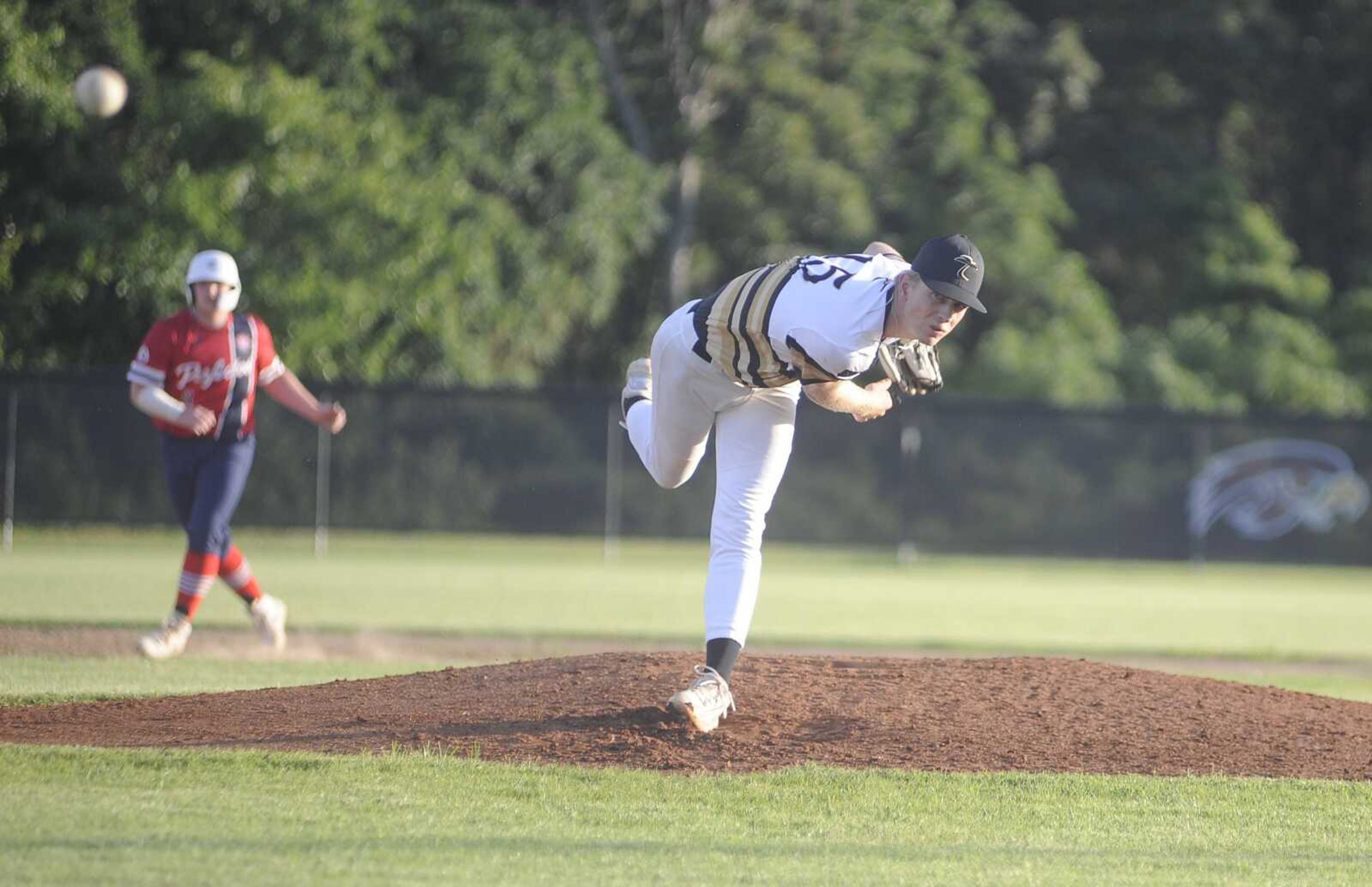 Southeast Tropics pitcher Kolten Payne throws against the Cardinal Legacy Perfectos on Tuesday at Kelly High School in Benton.